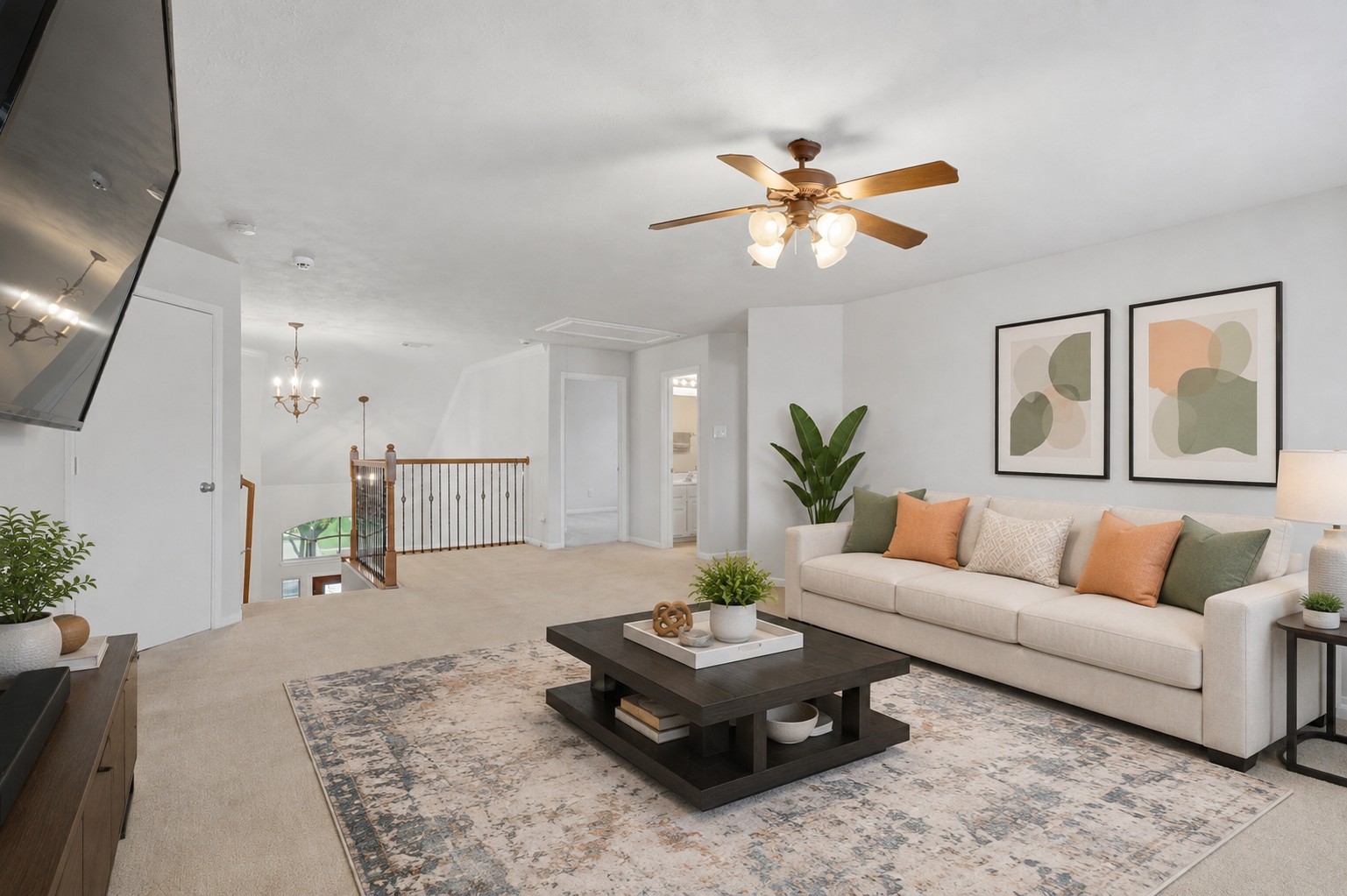 Another view of the upstairs game room highlights its open layout, spacious proportions, and connection to the second-floor landing.**Virtually staged