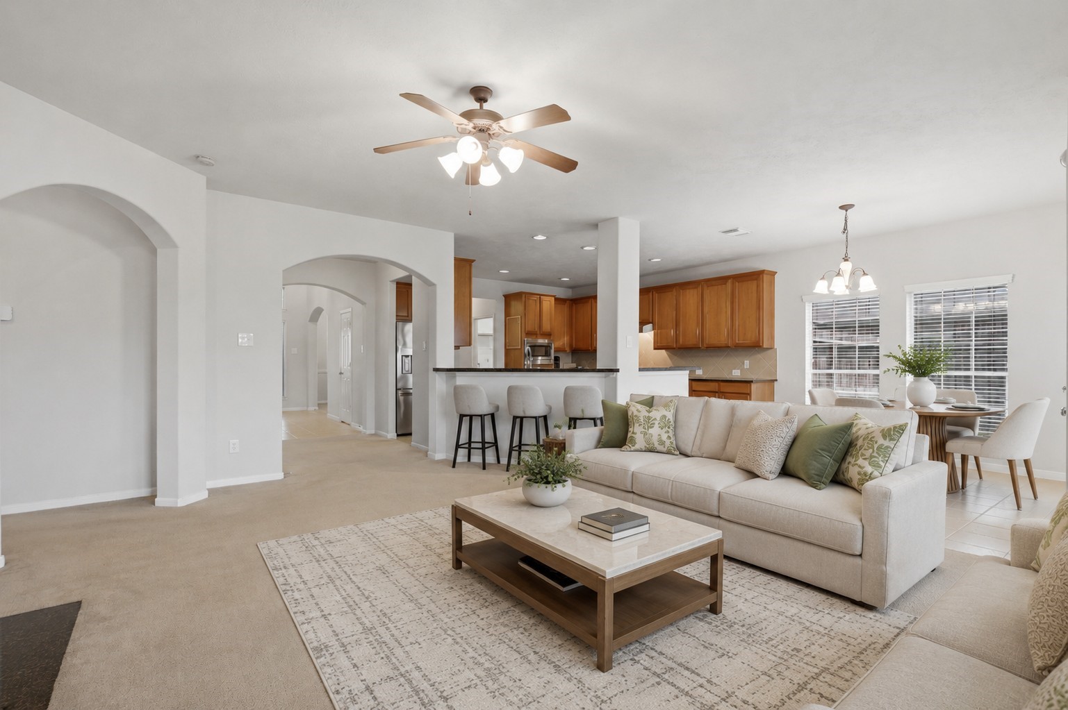 Another view highlights the expansive family room and its seamless flow into the kitchen and breakfast area.**Virtually staged