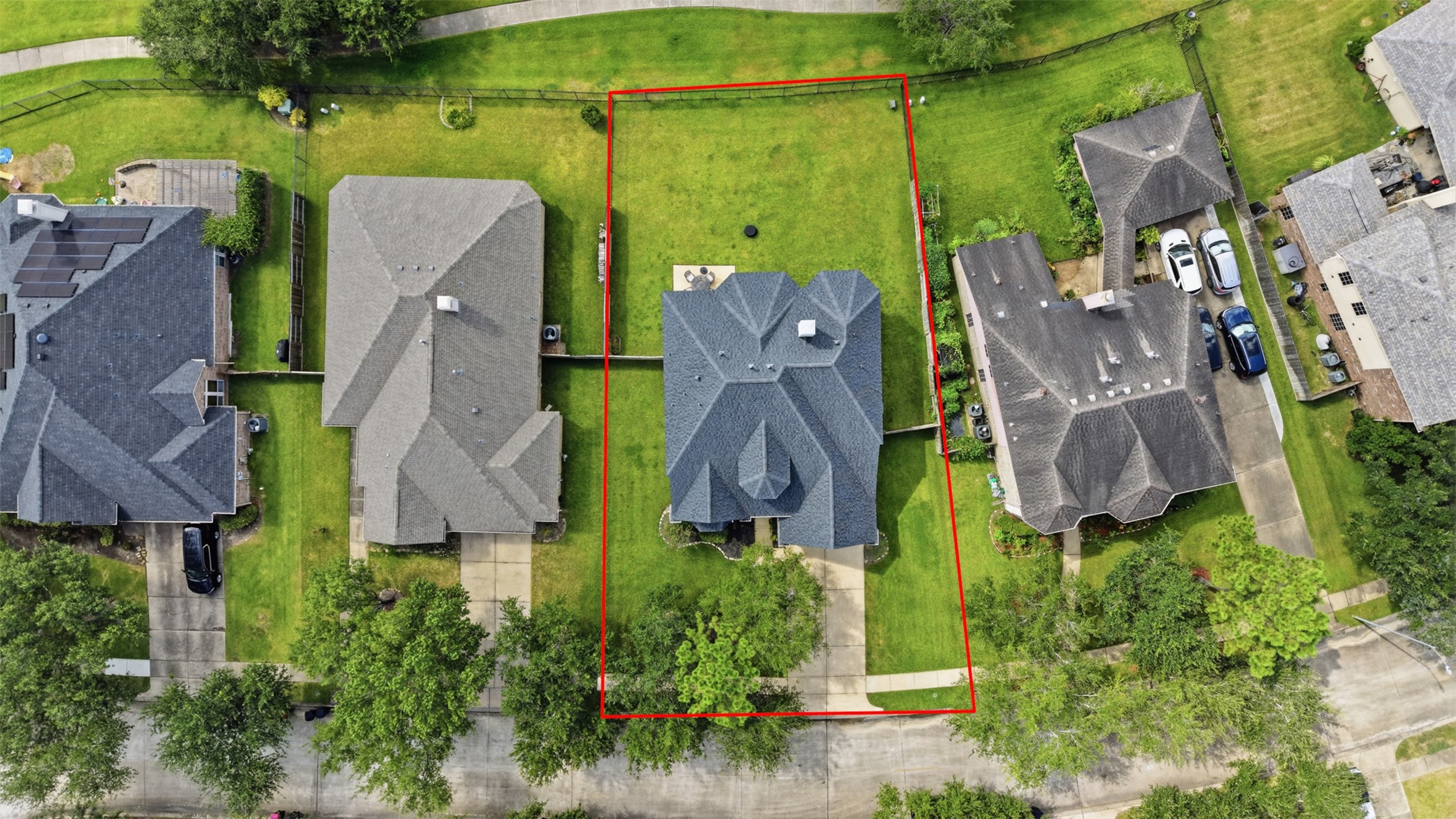The overhead view clearly showcases the property boundaries and the generous lot surrounding the home.