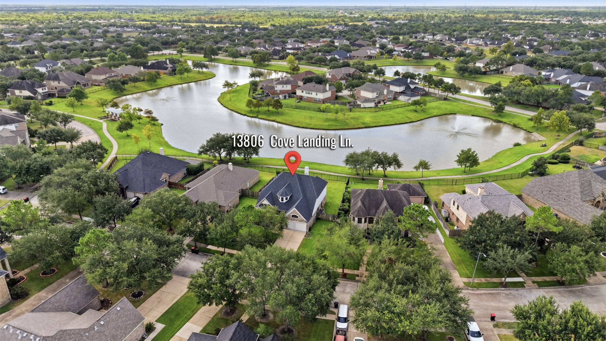 The home enjoys a desirable setting with a community lake and walking path located directly behind the property.