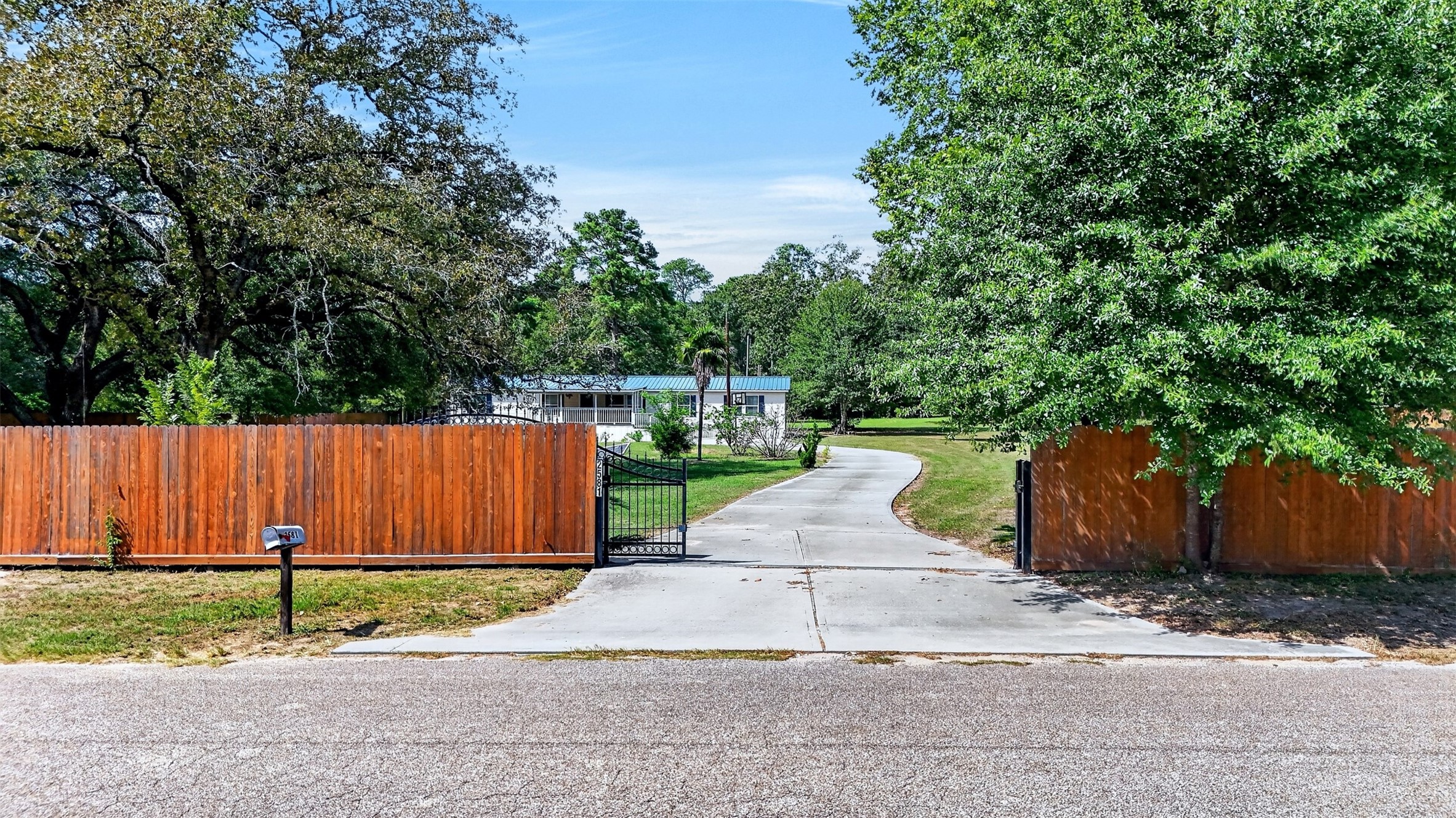 Gated driveway provides added privacy and access to the property.