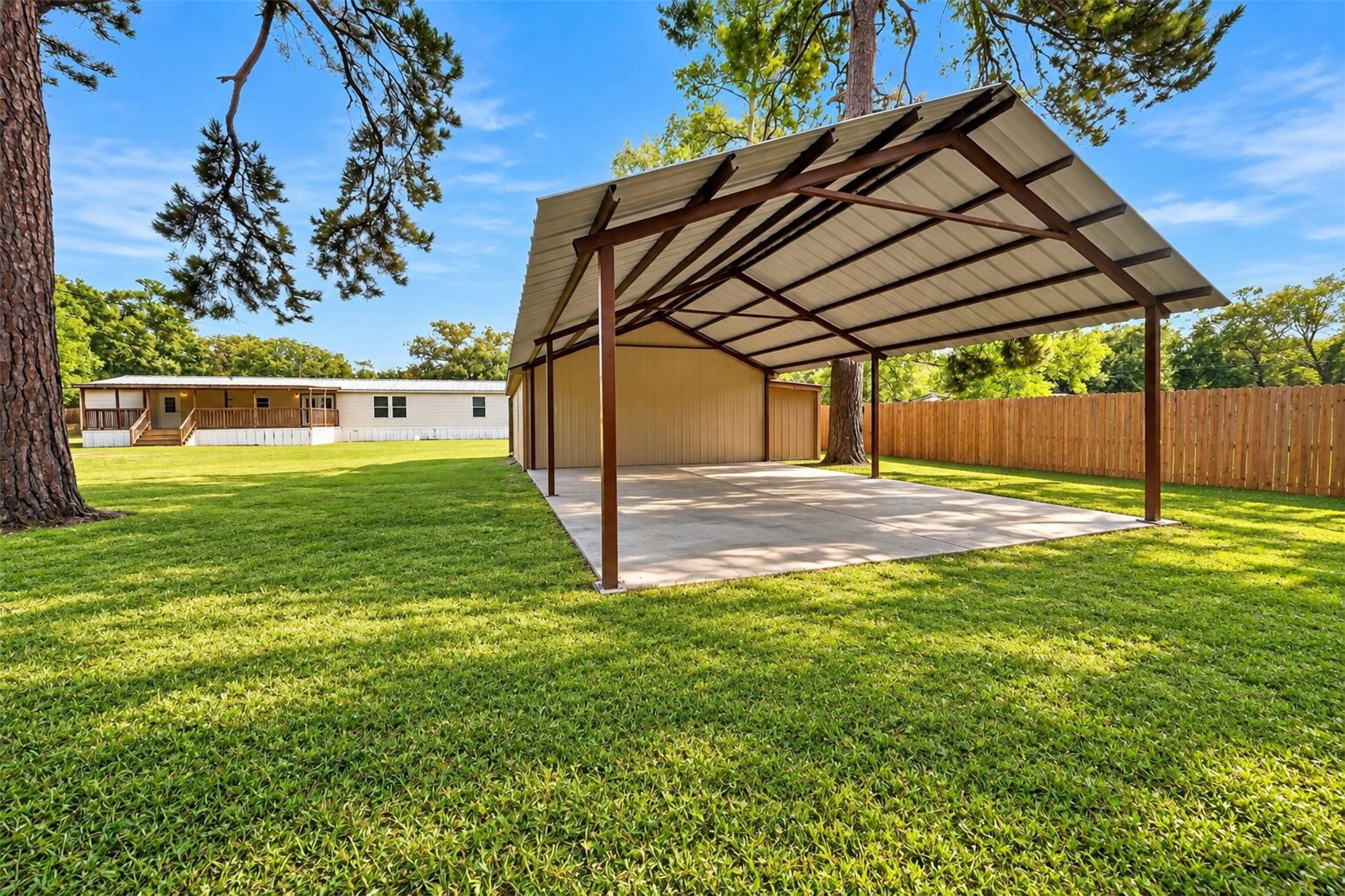 Covered outdoor pavilion creates an additional space for gatherings, dining, or relaxing outdoors.