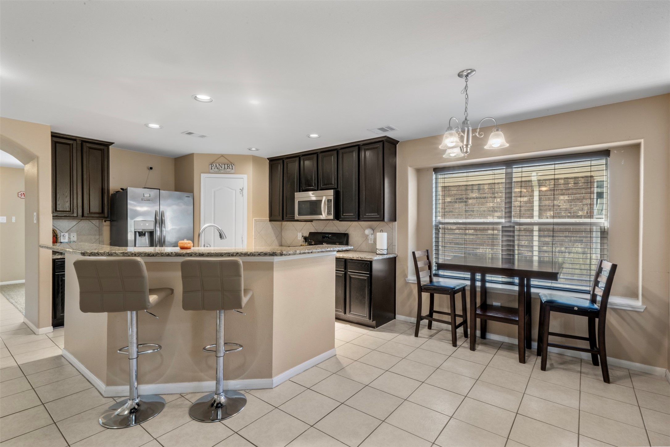 view of kitchen and one of the two dinning areas.