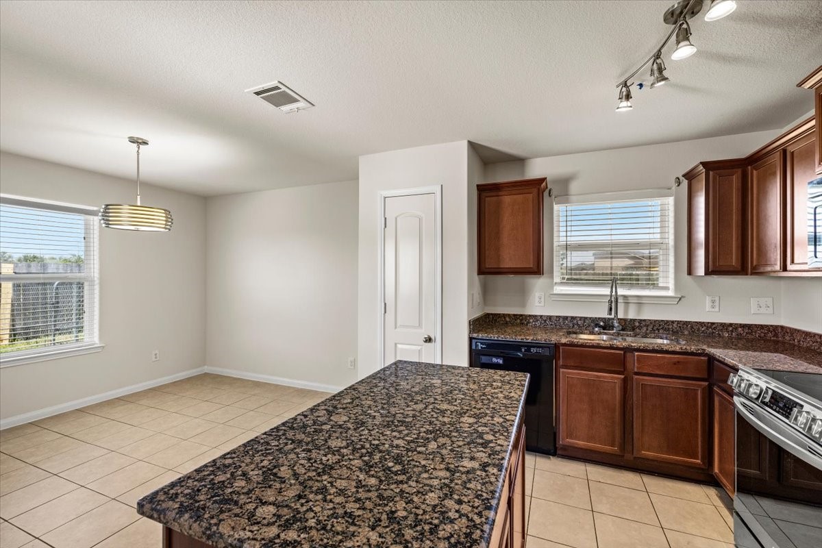 Granite kitchen island open to dining area