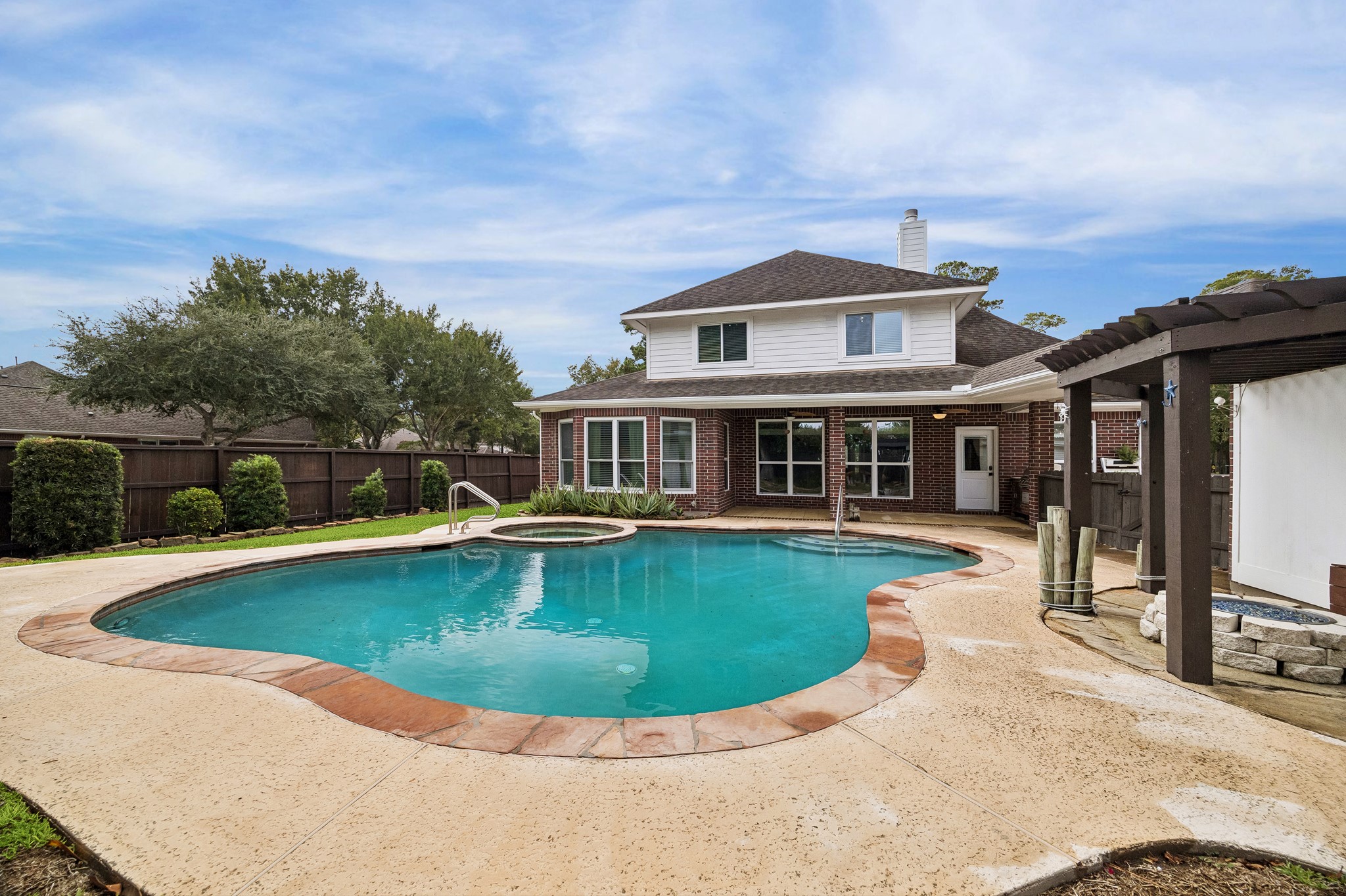 Pool and back view of the home