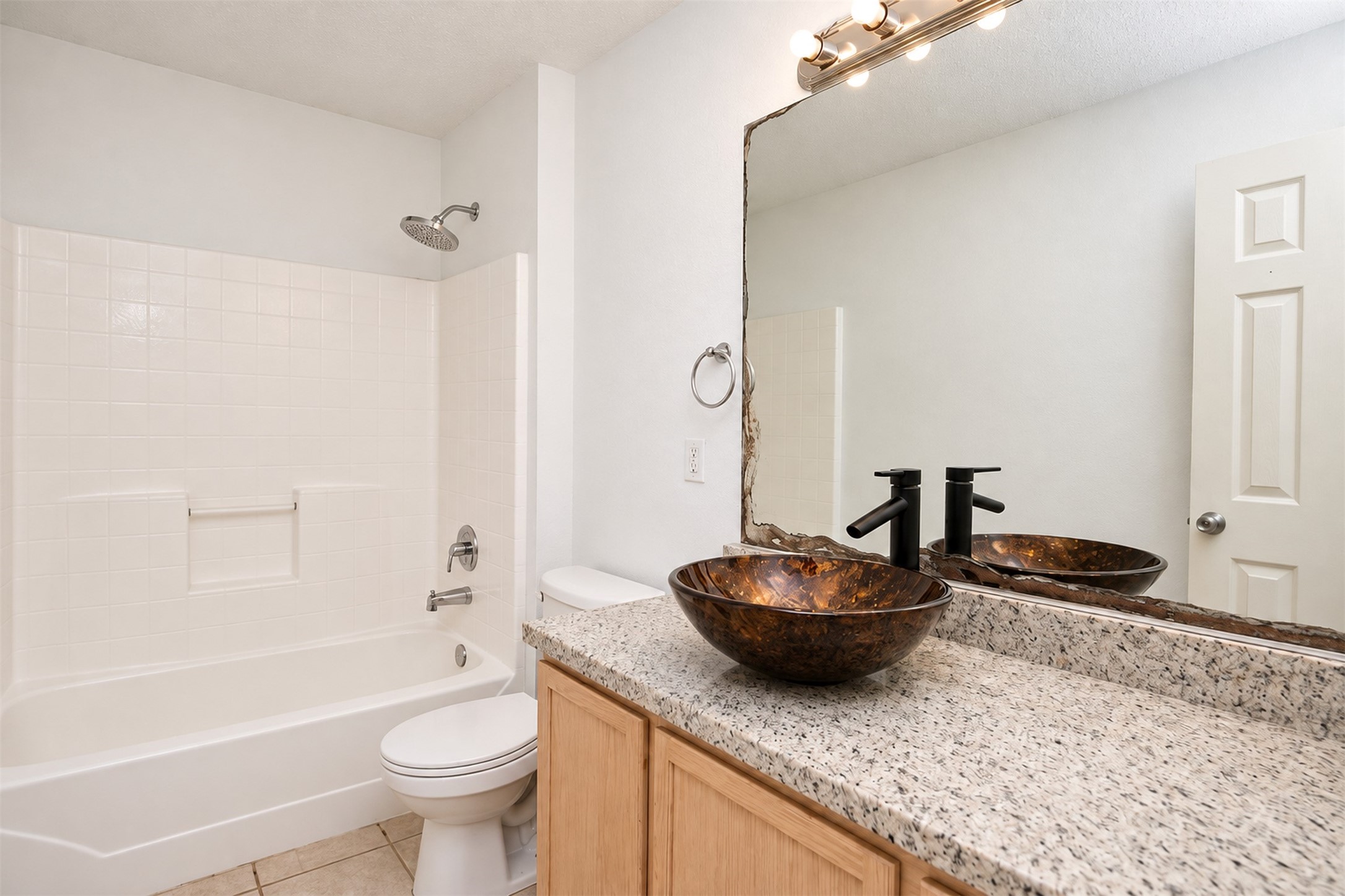Shared Bathroom
***Property is vacant. Photo digitally enhanced with AI; lighting, color, and ceiling appearance adjusted. ***