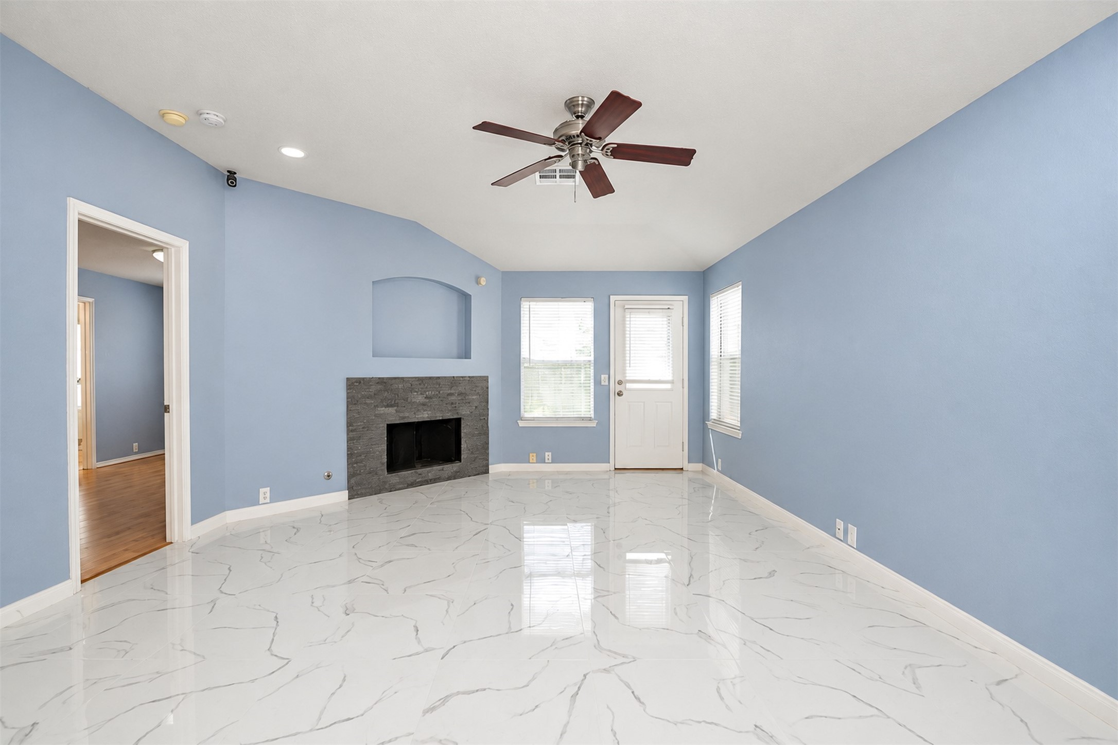 Living Area
***Property is vacant. Photo digitally enhanced with AI; lighting, color, and ceiling appearance adjusted. ***
