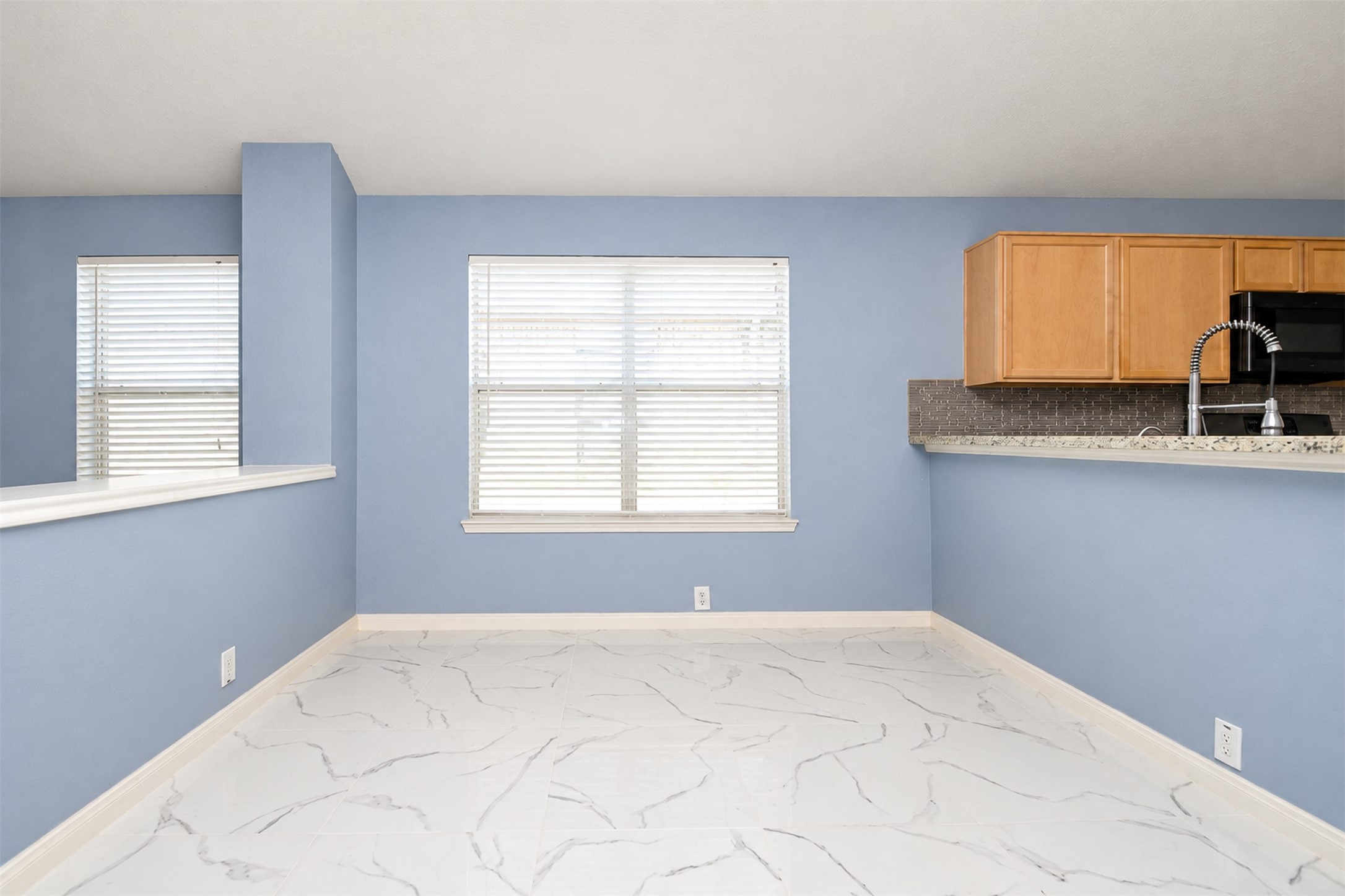 Breakfast Area/Extra Room 
***Property is vacant. Photo digitally enhanced with AI; lighting, color, and ceiling appearance adjusted. ***