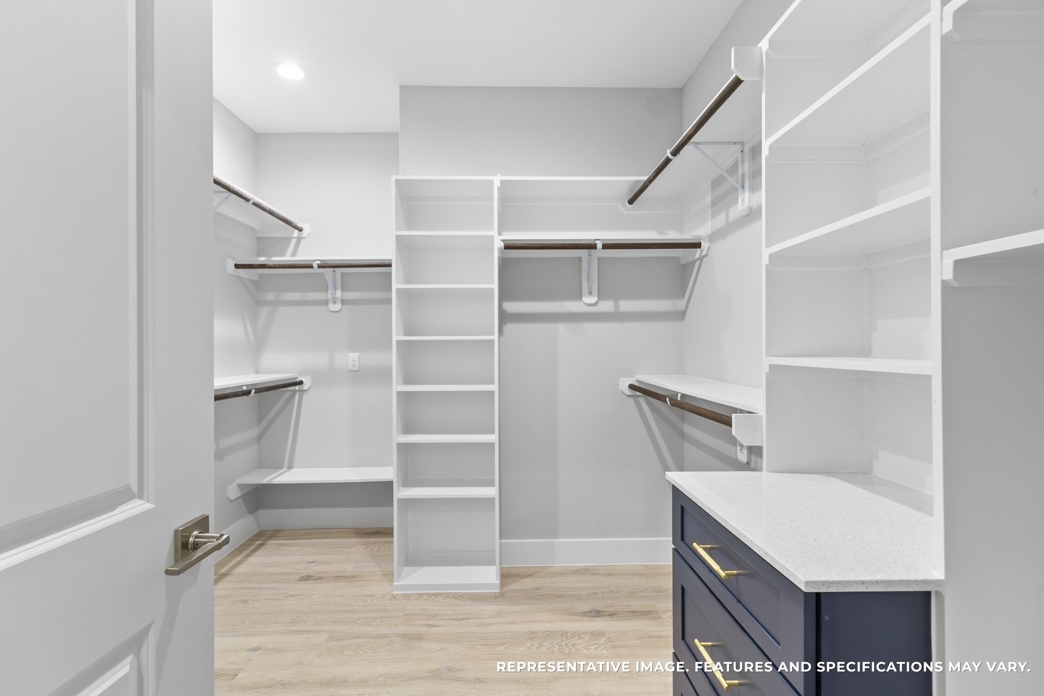 Every morning, sunlight pours into your spacious closet as you select your outfit for the day. With open shelving, ample hanging space, and built-in drawers, everything you own finally has its placeorganized and within reach.