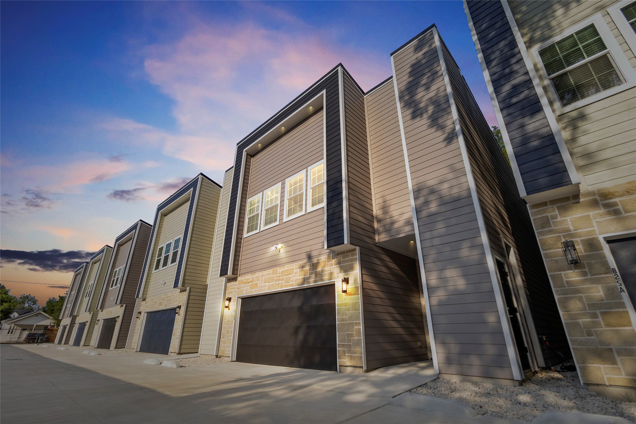 Every day starts with pride as you pull up to your modern two-story home, its bold navy accents and stonework setting the stage for a lifestyle thats as stylish as it is comfortable. The sleek lines of your faade give your place a fresh, standout curb appeal.