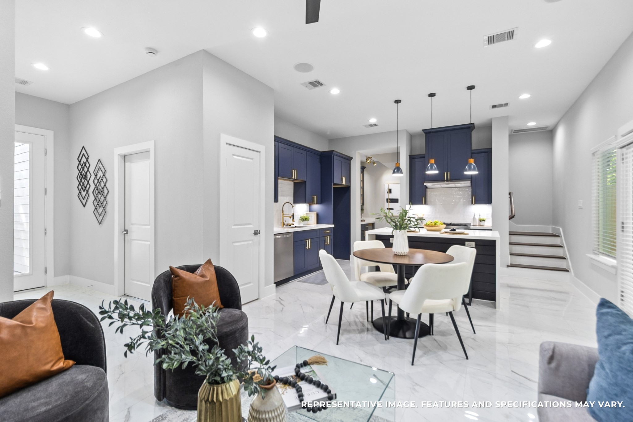 The deep navy cabinetry with gold hardware brings such a sophisticated pop to your kitchenyou cant help but smile every time you walk in.