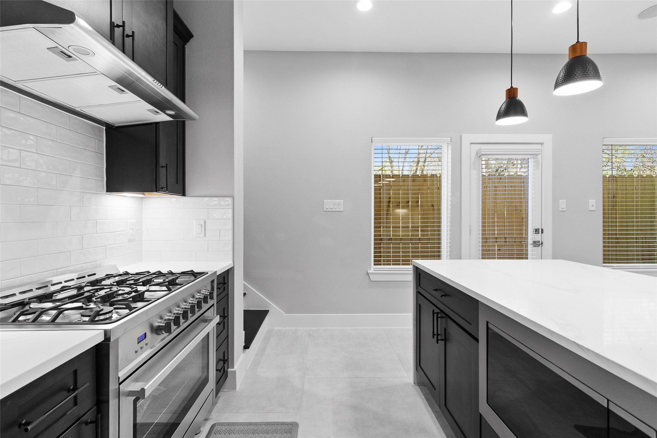 Your chefs kitchen, with its gas range and bold cabinetry, makes every meal feel like it was prepared in a restaurant-worthy space.