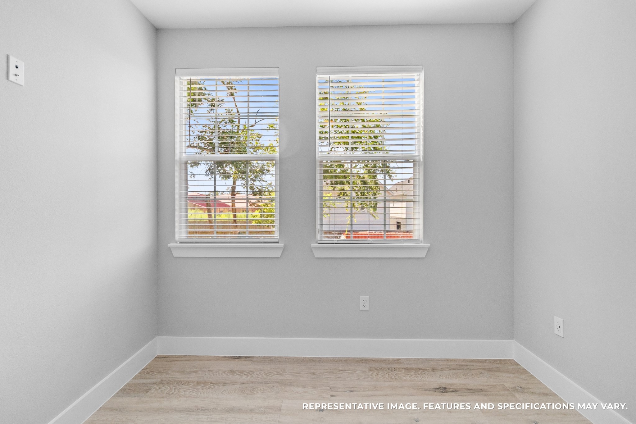 From another angle, you see how the sunlight pours through the windows, making the room warm and welcoming no matter its use.