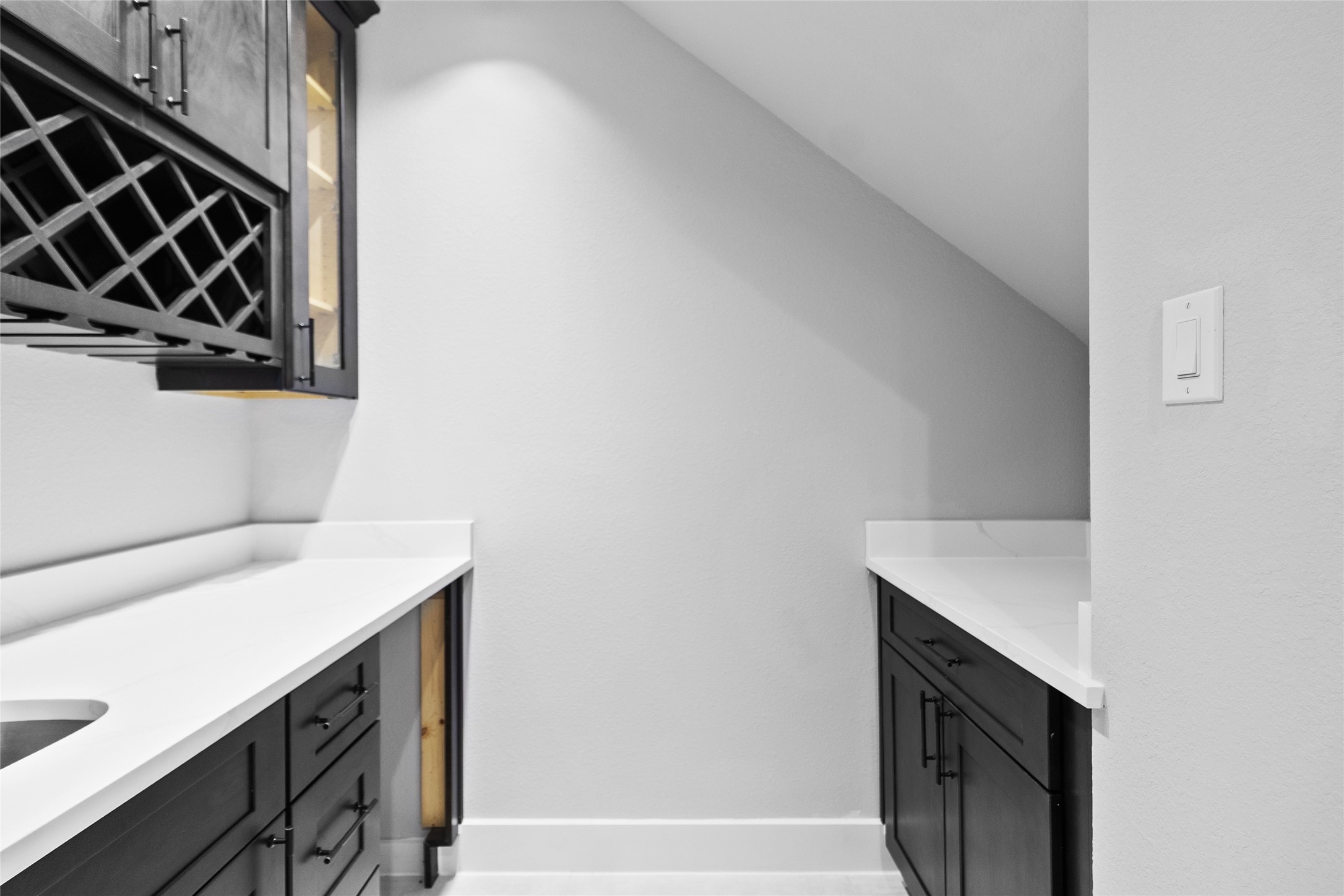 Just off the kitchen, your built-in bar with wine storage makes hosting feel seamlessyoure always ready to pour a glass and enjoy.