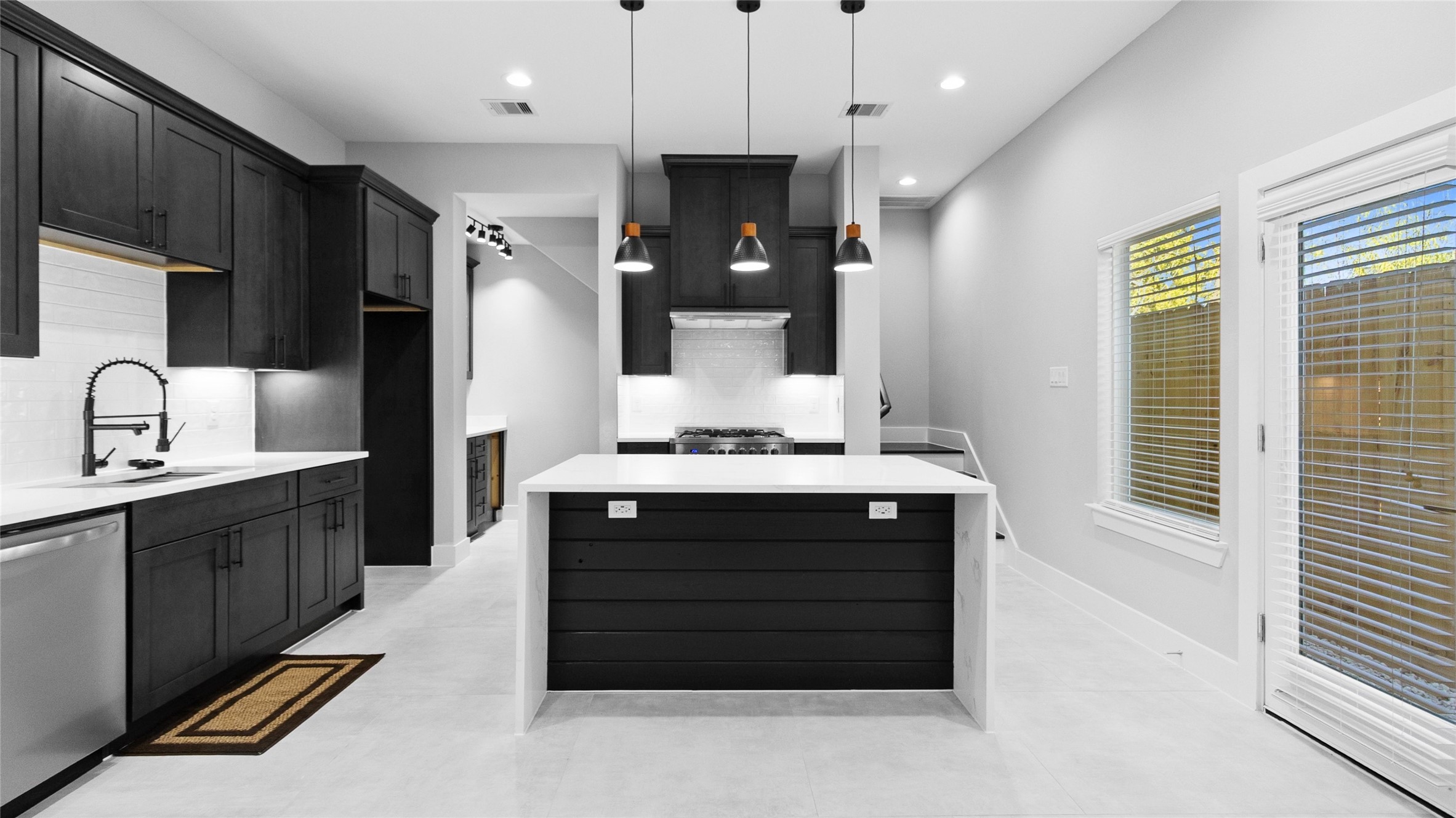 The kitchen island is where you gather most, whether for a quick breakfast or setting out snacks when friends come by.