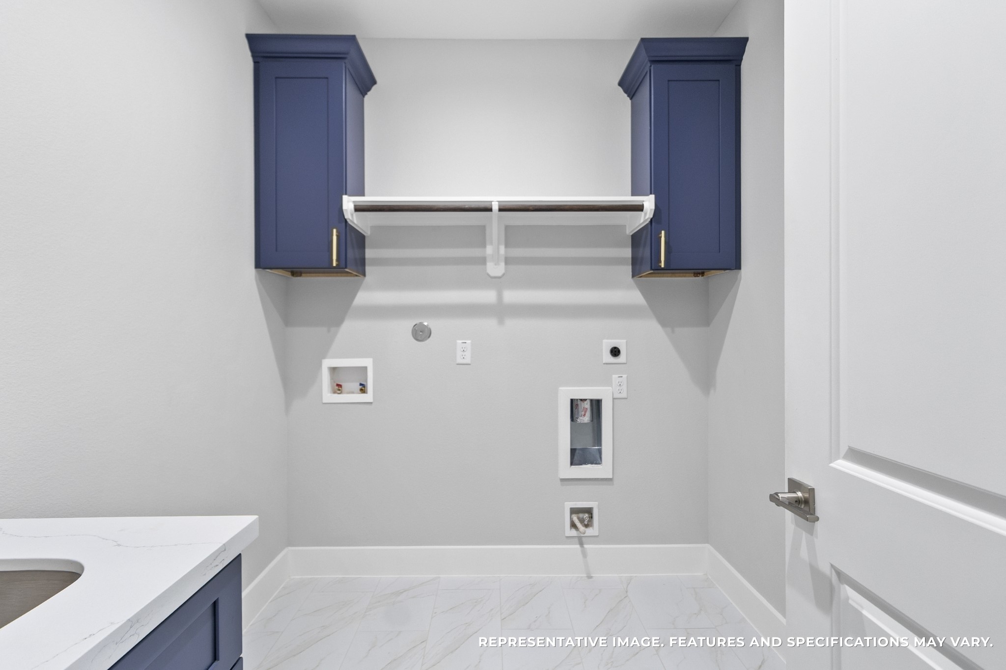 Laundry days are no longer a chore in your dedicated utility room. With sleek cabinetry for storage and open shelving for supplies, you keep everything tidy and accessible, making this space as functional as it is stylish.