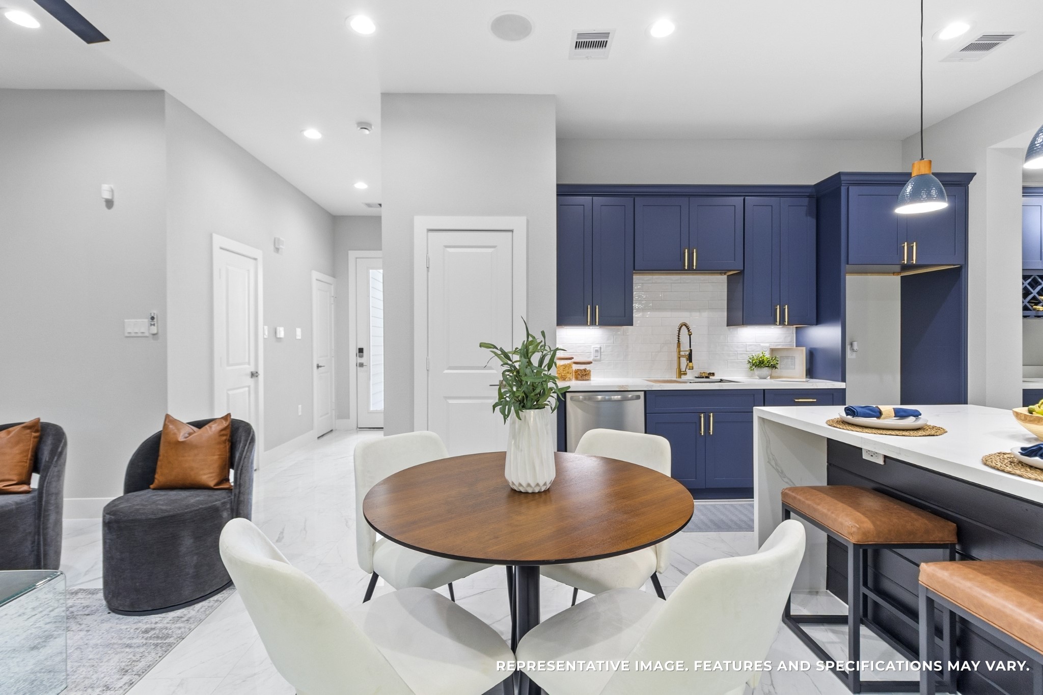 Dinner feels relaxed around your round table, the soft lighting above setting the mood whether its a quick weekday meal or a long weekend gathering.