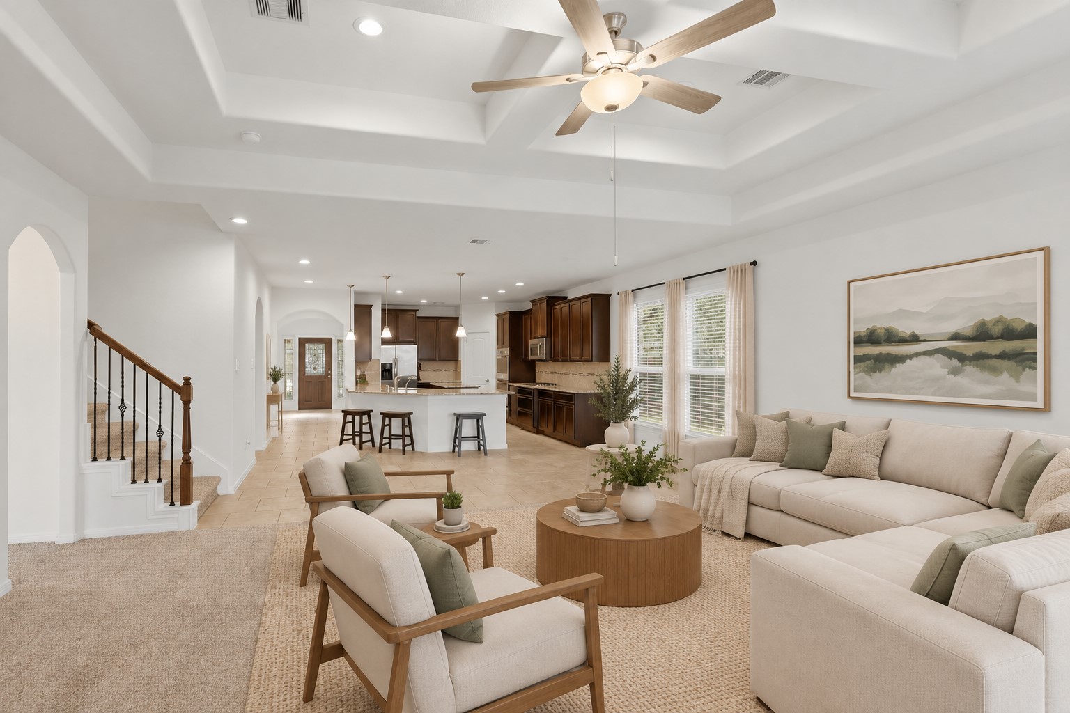 Open, Spacious & So Comfortable! You can really appreciate the wonderful open floor plan from this view. The spacious family room flows beautifully into the kitchen and dining areas, while the dramatic ceiling details add an elegant touch. Large windows bring in plenty of natural light, and the stone fireplace creates a cozy gathering spot for family evenings and entertaining. *Photo is virtually staged*