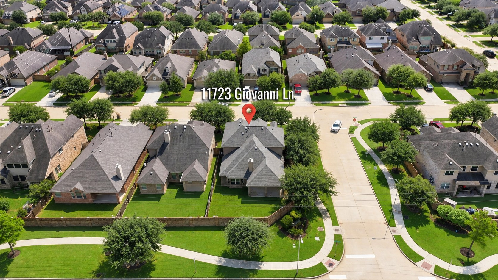 A Fantastic View of the Home & Its Corner-Lot Setting! This aerial perspective gives you a great look at the home's generous corner lot, attractive landscaping, private backyard, and surrounding neighborhood. The wide streets, sidewalks, mature trees, and beautifully maintained homes create a welcoming community atmosphere.