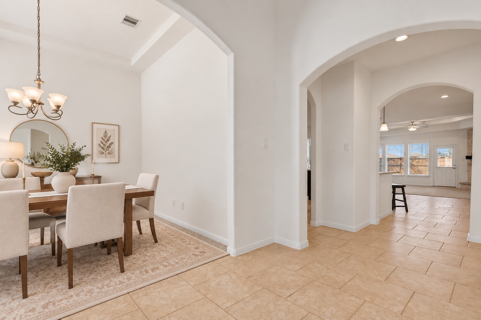 Beautifully Appointed Formal Dining! The spacious dining area sits gracefully just off the grand foyer, featuring elegant coffered ceiling details, a lovely chandelier, and plenty of natural light. The arched opening adds a beautiful touch and creates an easy flow into the adjoining living spaces. *Photo is virtually staged* Beautifully Appointed Formal Dining! The spacious dining area sits gracefully just off the grand foyer, featuring elegant coffered ceiling details, a lovely chandelier, and plenty of natural light. The arched opening adds a beautiful touch and creates an easy flow into the adjoining living spaces. *Photo is virtually staged*