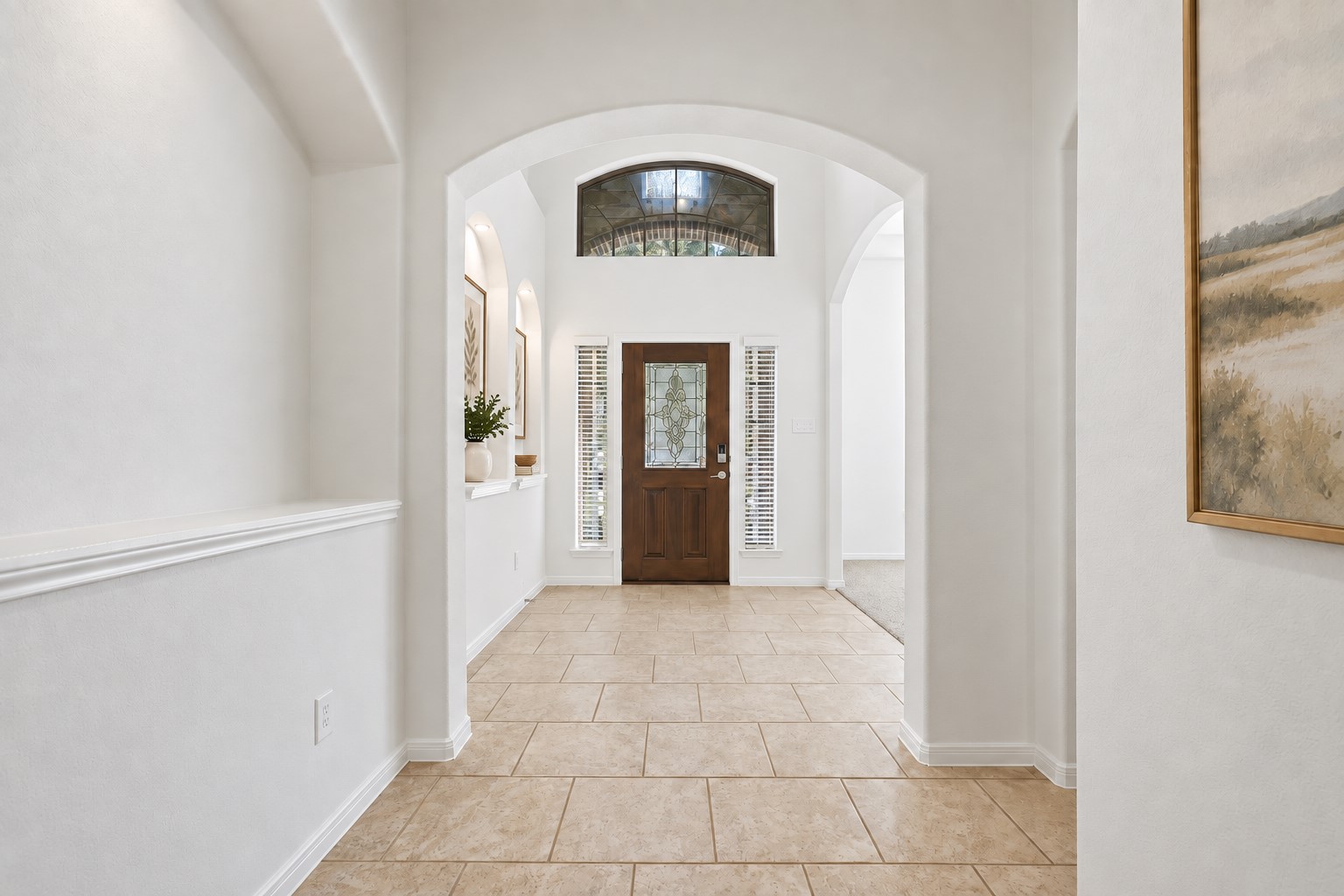 Now This Is a Grand Welcome Home! Step inside to a spacious foyer featuring soaring ceilings, beautiful tile flooring, graceful archways, decorative art niches, and wonderful natural light. The elegant architectural details immediately give the home a feeling of space and sophistication. A beautiful first impression that sets the tone for the rooms ahead! *Photo is virtually staged* Now This Is a Grand Welcome Home! Step inside to a spacious foyer featuring soaring ceilings, beautiful tile flooring, graceful archways, decorative art niches, and wonderful natural light. The elegant architectural details immediately give the home a feeling of space and sophistication. A beautiful first impression that sets the tone for the rooms ahead! *Photo is virtually staged*