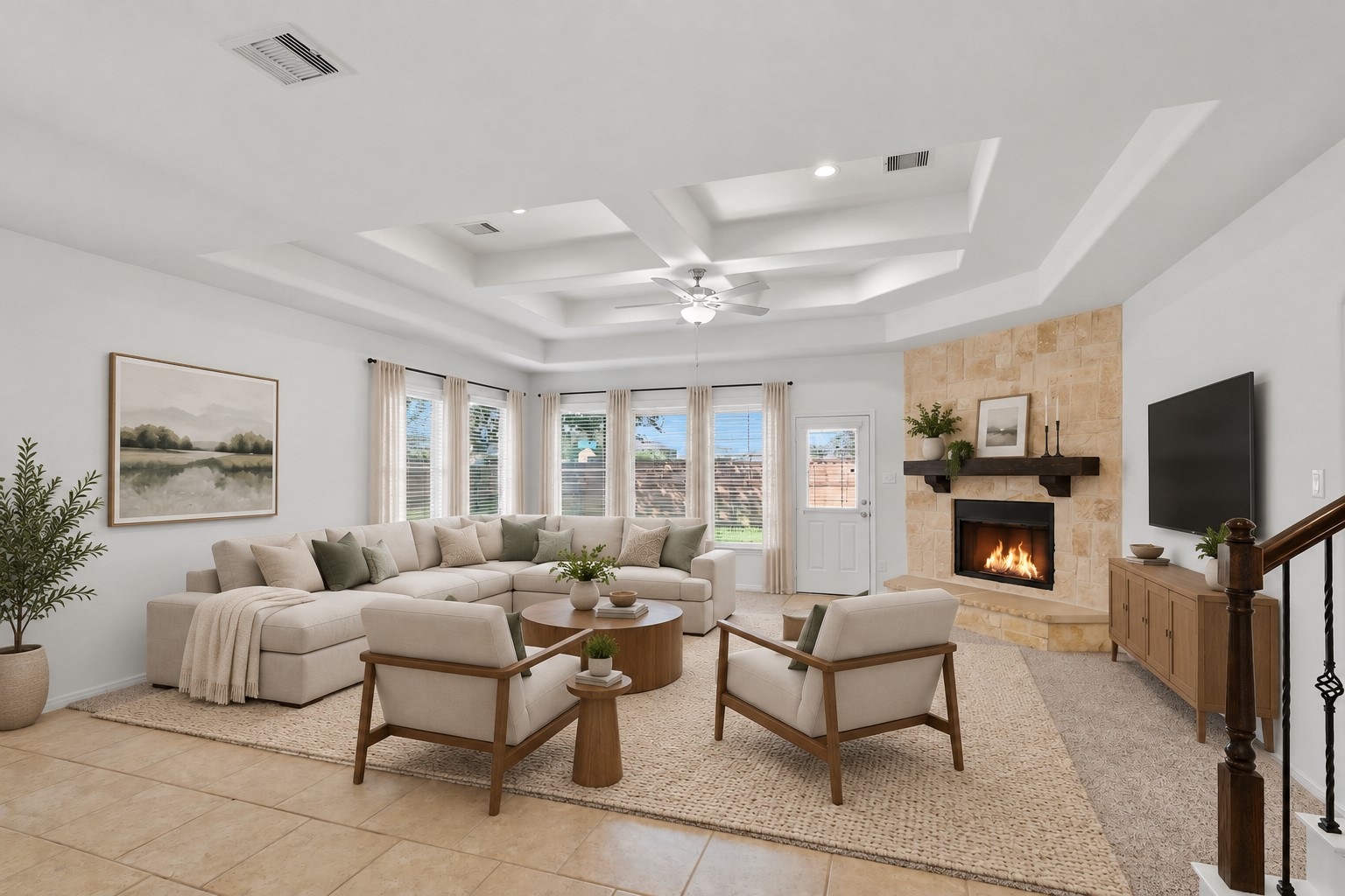What a Wonderful Family Gathering Space! This impressive family room features soaring custom ceilings, beautiful architectural details, a stunning stone fireplace, and a wall of windows bringing in wonderful natural light. The open connection to the kitchen makes this room ideal for relaxing with family or entertaining friends. It is spacious, comfortable, and truly feels like the heart of the home! *Photo is virtually staged*