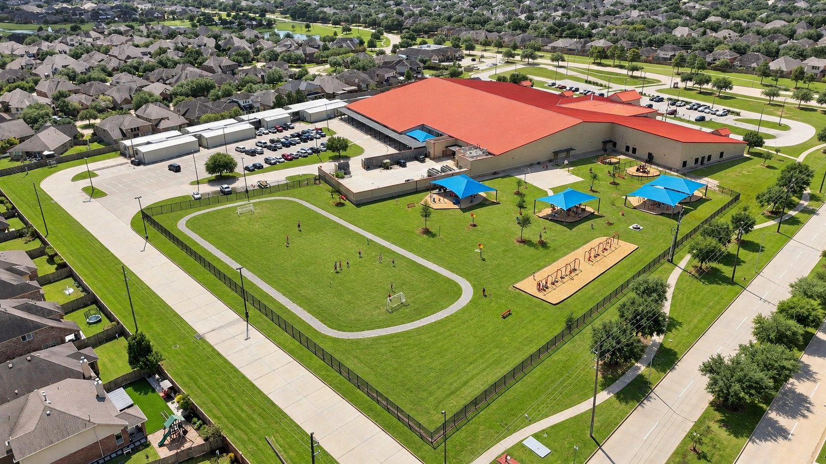 Resort-Style Amenities Right in the Neighborhood! This beautiful aerial view showcases a wonderful community amenity area with expansive green space, recreational courts, a swimming pool, playground areas, and walking paths. It is easy to see why residents enjoy having so many opportunities for recreation, relaxation, and outdoor fun close to home!