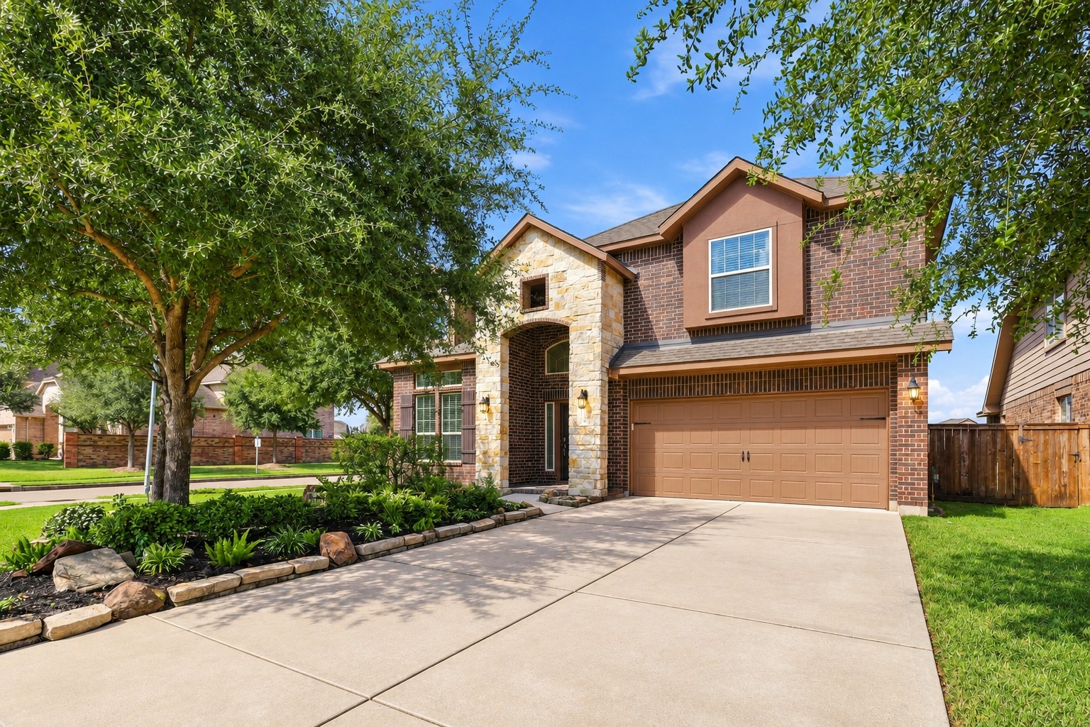 A Beautiful Home with Wonderful Street Presence! You will love the combination of stone accents, brick detailing, mature trees, and beautifully landscaped flower beds. The spacious driveway provides a welcoming approach to the home, while the elegant two-story design gives it a wonderful presence from the street. A Beautiful Home with Wonderful Street Presence! You will love the combination of stone accents, brick detailing, mature trees, and beautifully landscaped flower beds. The spacious driveway provides a welcoming approach to the home, while the elegant two-story design gives it a wonderful presence from the street.