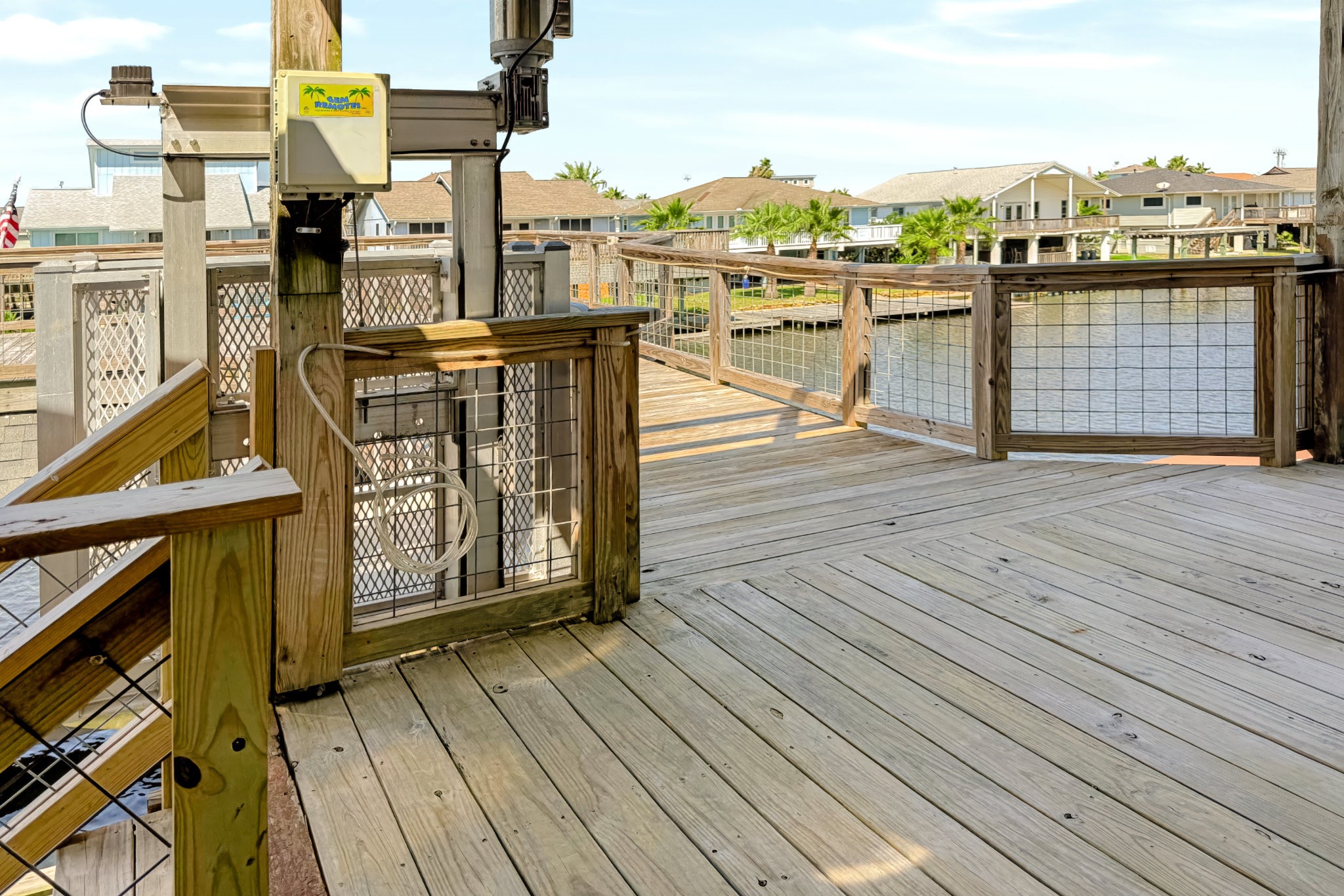 ANOTHER VIEW OF BACK STAIRS LANDING AND CARGO LIFT AND CAT WALK OUT TO DECK OVER BOAT HOUSE
