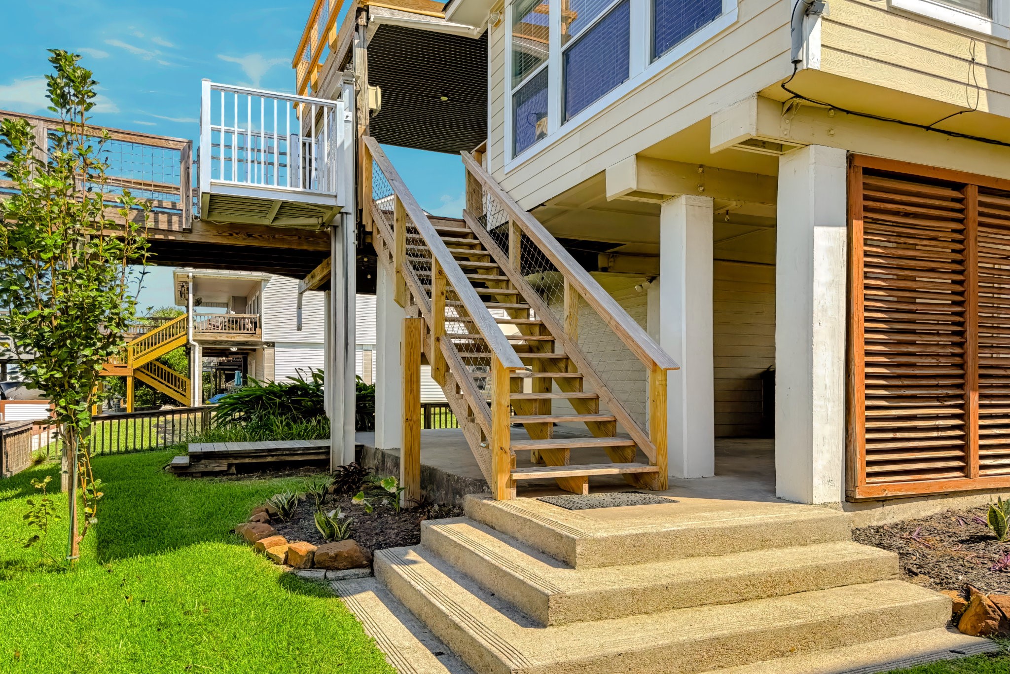 AMAZING CONCRETE STEPS AT BOTTOM OF BACK STAIRS ON CANAL SIDE OF HOME