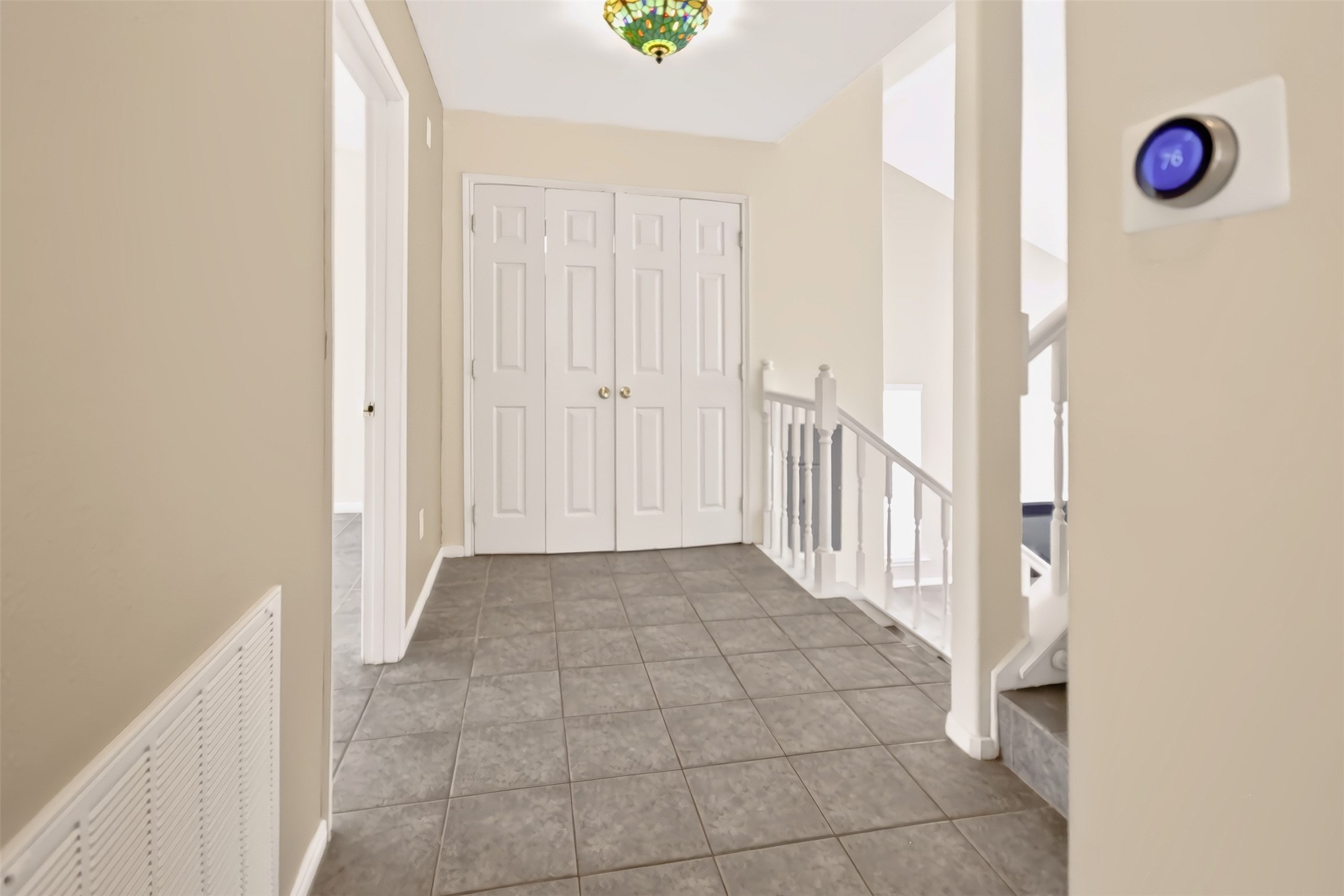HALL AREA AND THE LAUNDRY AREA AT DOUBLE DOORS FOR EASY ACCESS. NEST THERMOSTAT