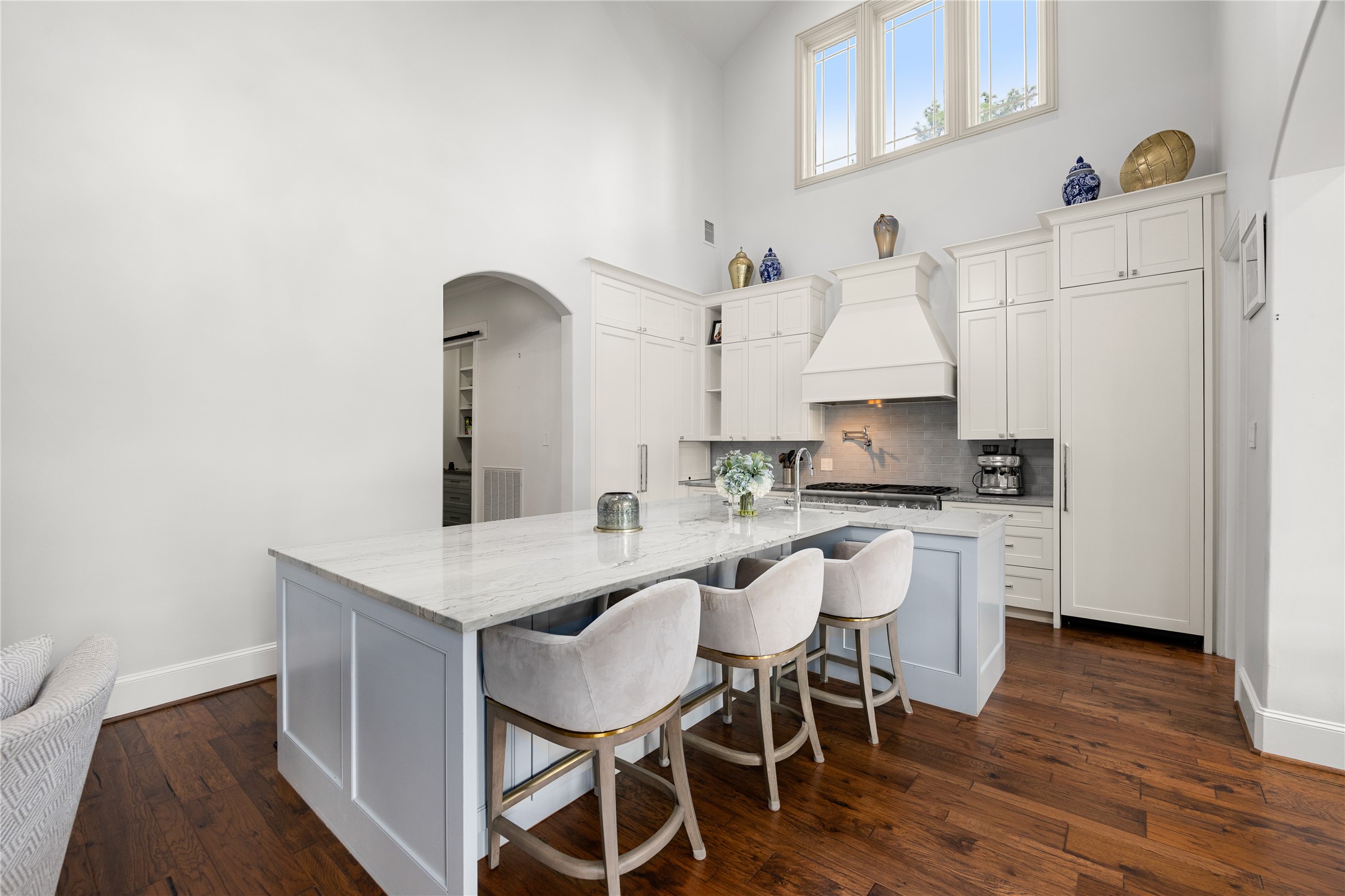 Island seating at the breakfast bar in the kitchen.