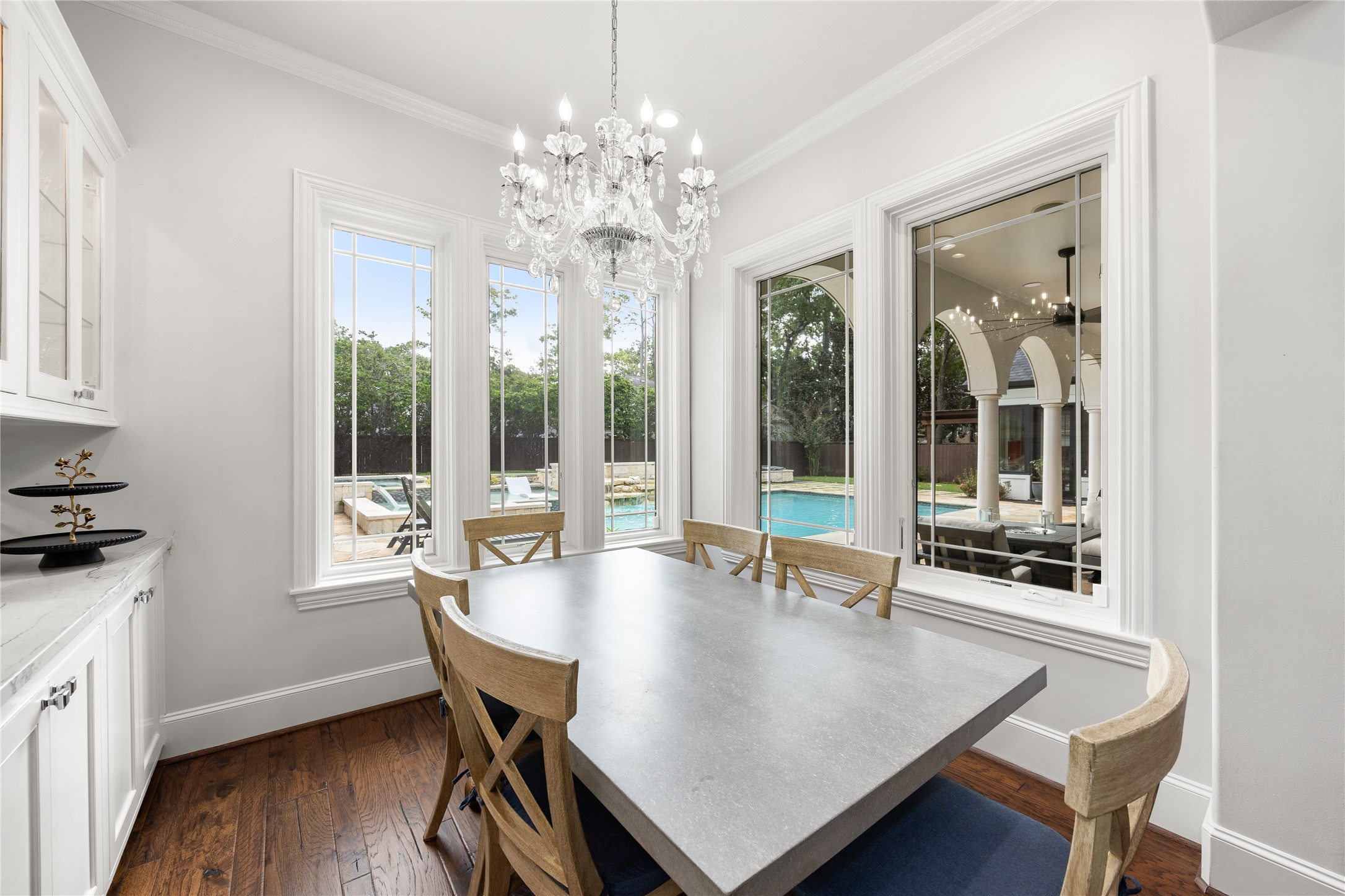 Breakfast room has windows that overlook the stunning backyard and pool.