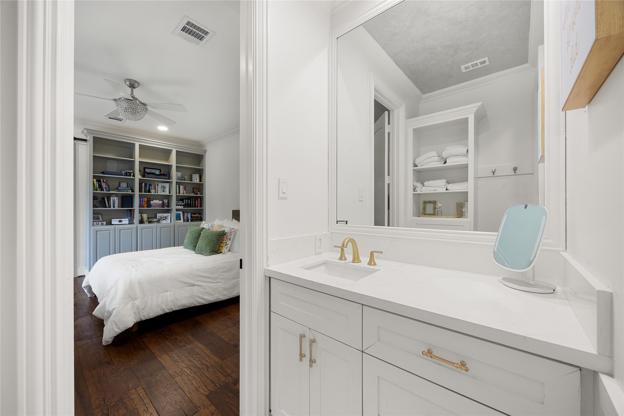 Ensuite bathroom has a tub/shower combo and a vanity area, with access to the front balcony.