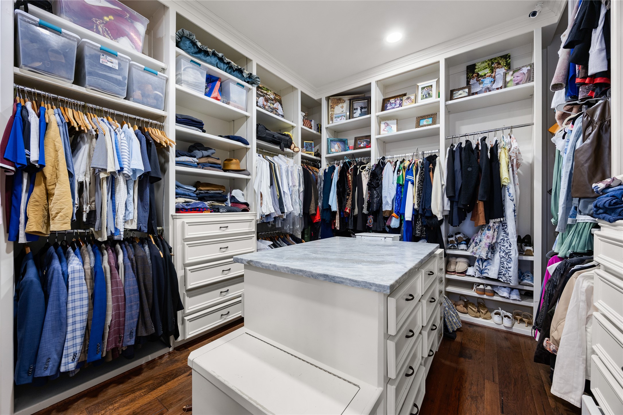 Large Primary closet has built in drawers and plenty of storage.