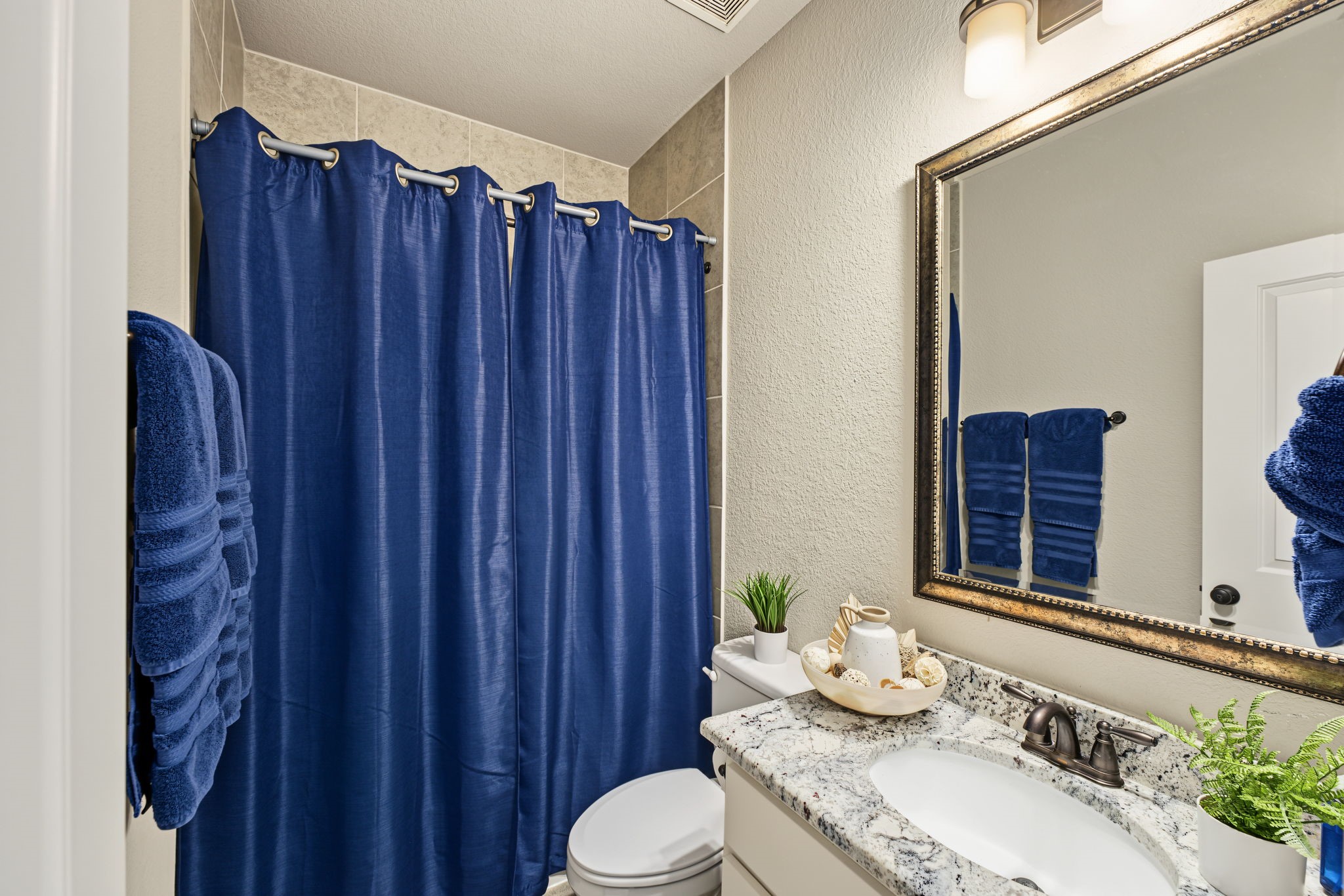 Beautifully appointed full en-suite bathroom conveniently connected to the upstairs bedroom, offering comfort, privacy, and convenience for family or guests!