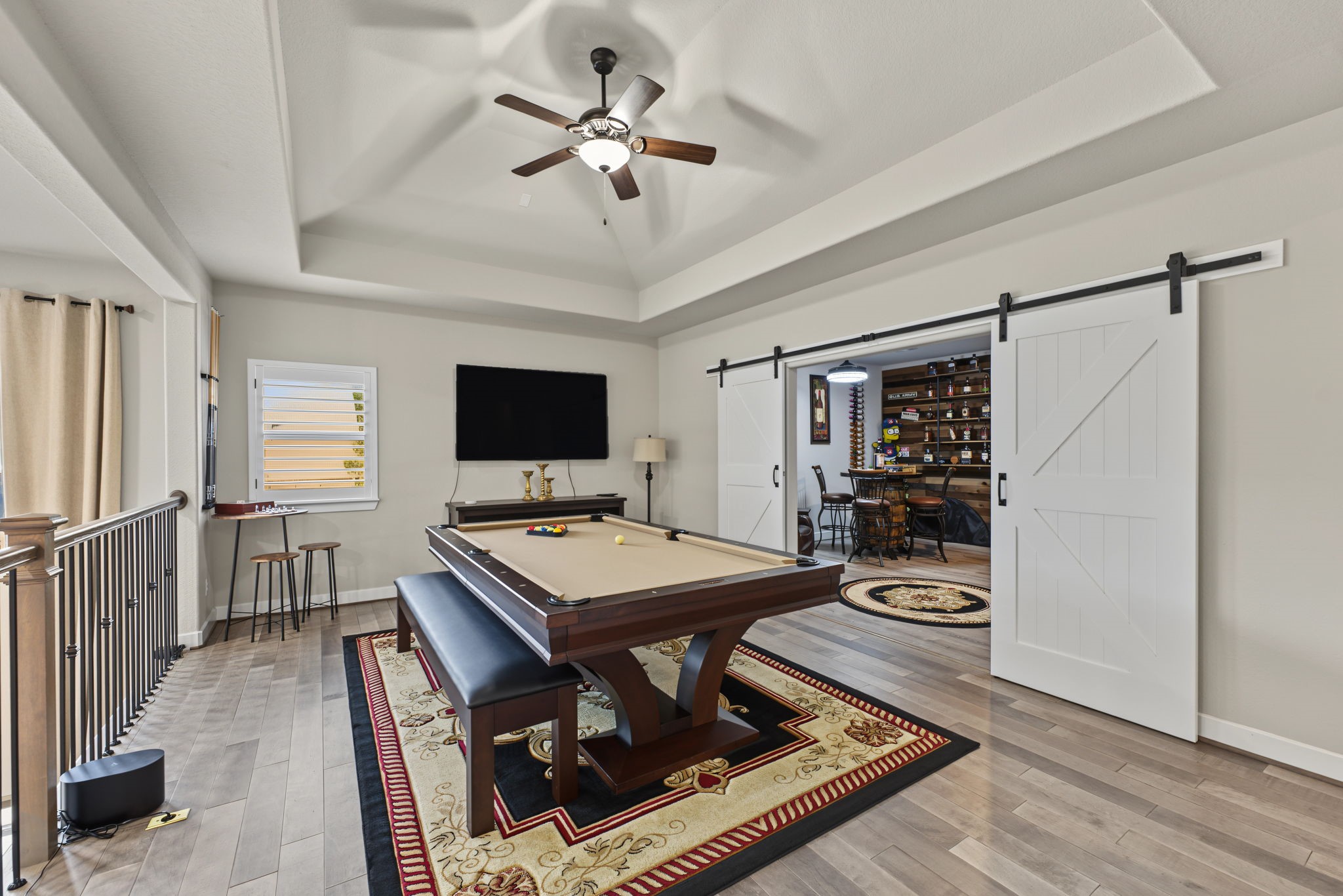 Fantastic Upstairs Game Room! Spacious entertainment area featuring a tray ceiling and plenty of room for a pool table, games, or additional seating.