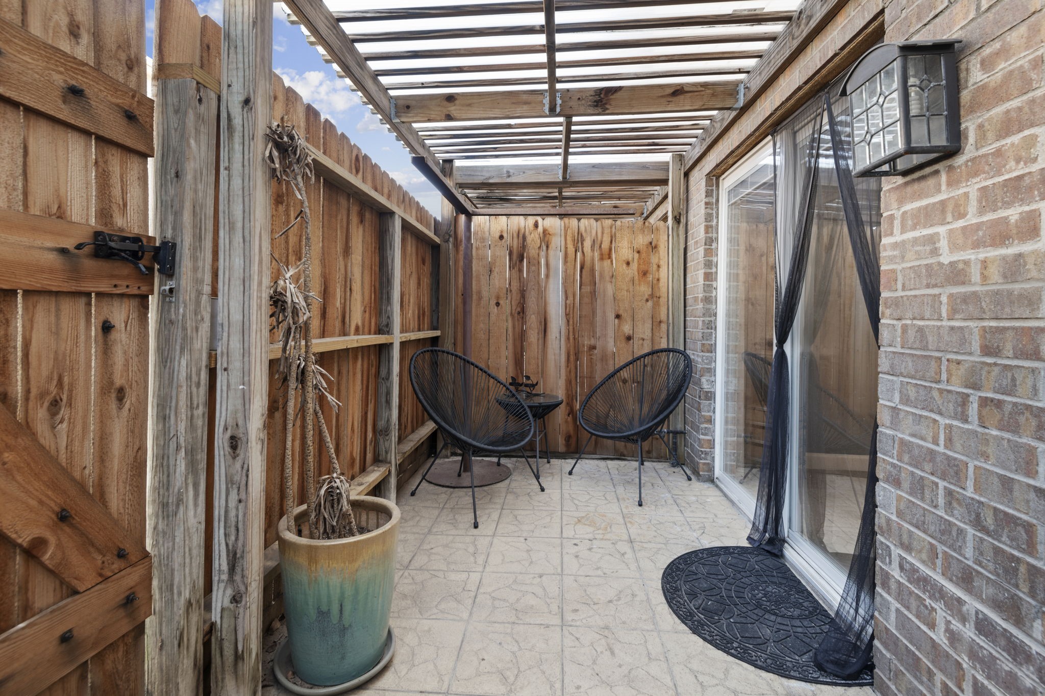 This private covered and fenced in porch area is the perfect place to grab a cup of coffee and relax. This private covered and fenced in porch area is the perfect place to grab a cup of coffee and relax.