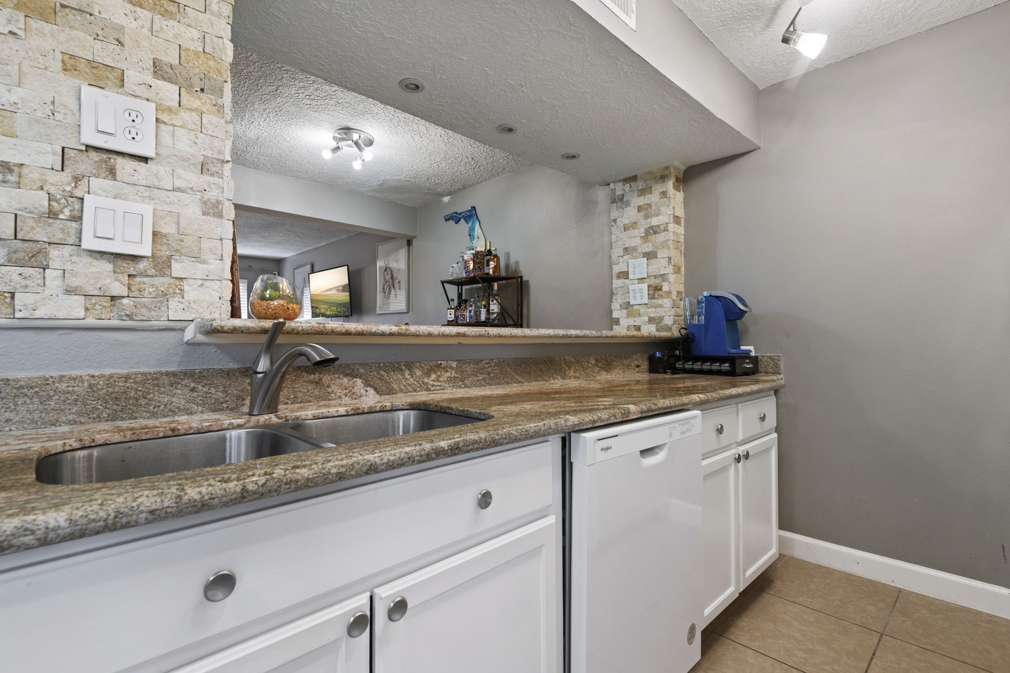 A double sink and a breakfast bar are great features of this kitchen. A double sink and a breakfast bar are great features of this kitchen.