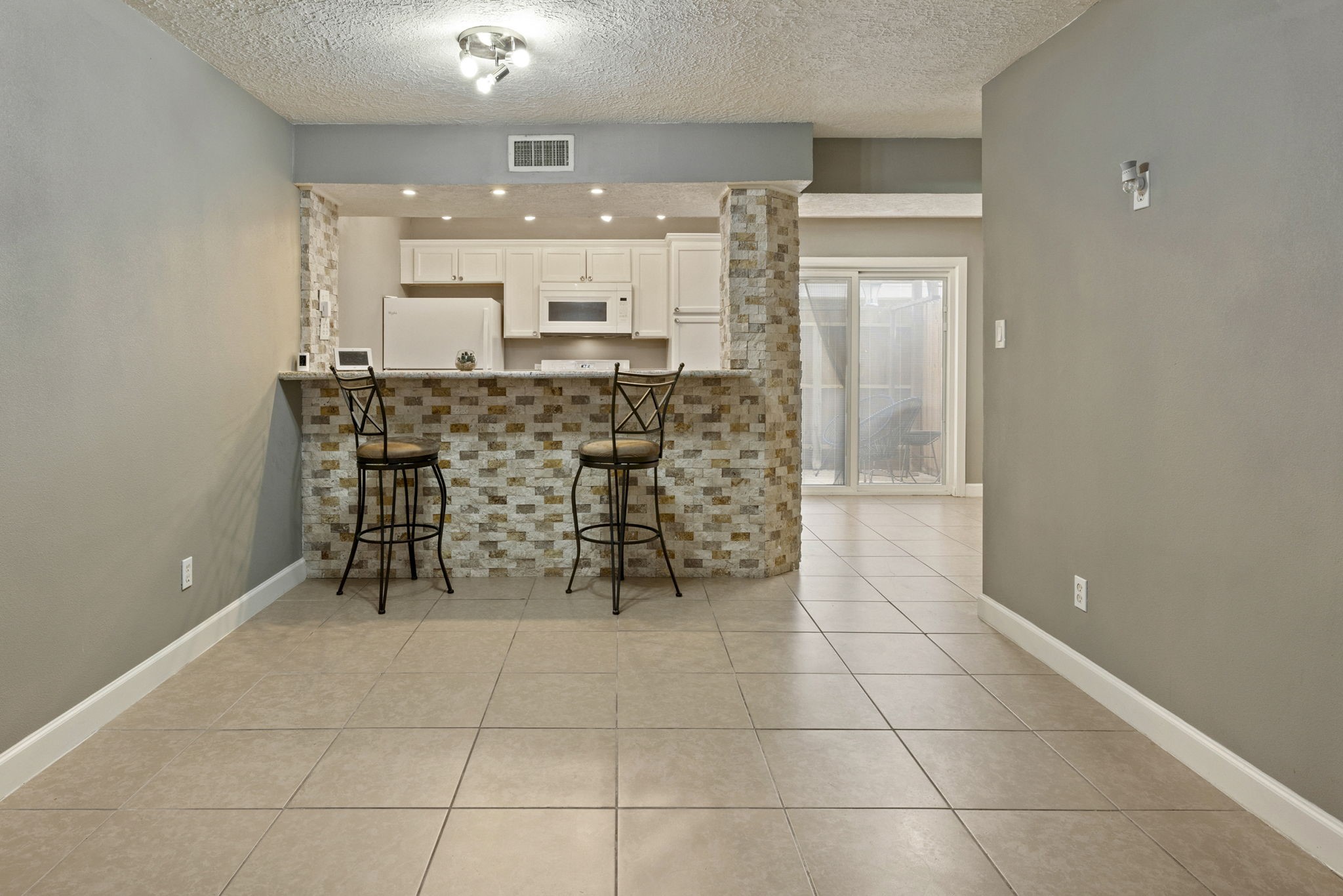 Just beyond the living room is great space for a dining table.