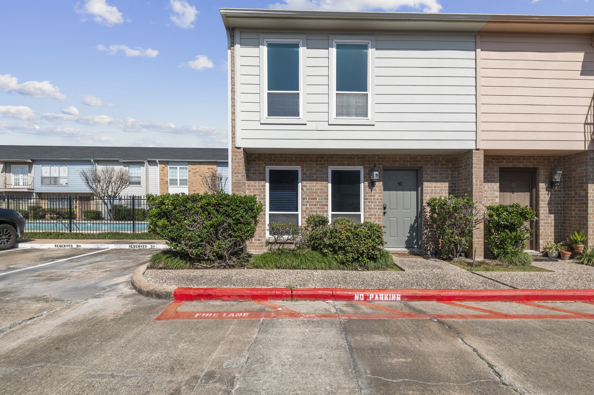 This 2 bedroom, 2.5 bath home sits directly next to the community pool and has two assigned parking spots seen here next to the unit. End unit with only one shared wall makes it ideal for privacy! This 2 bedroom, 2.5 bath home sits directly next to the community pool and has two assigned parking spots seen here next to the unit. End unit with only one shared wall makes it ideal for privacy!