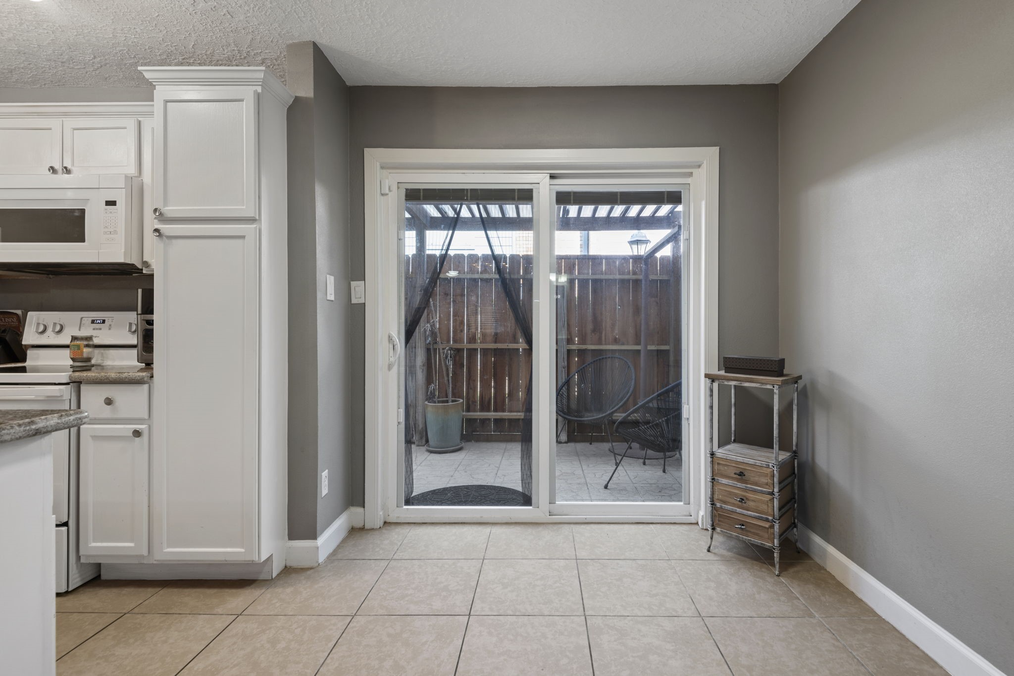 The breakfast room leads to the fenced in private porch area.