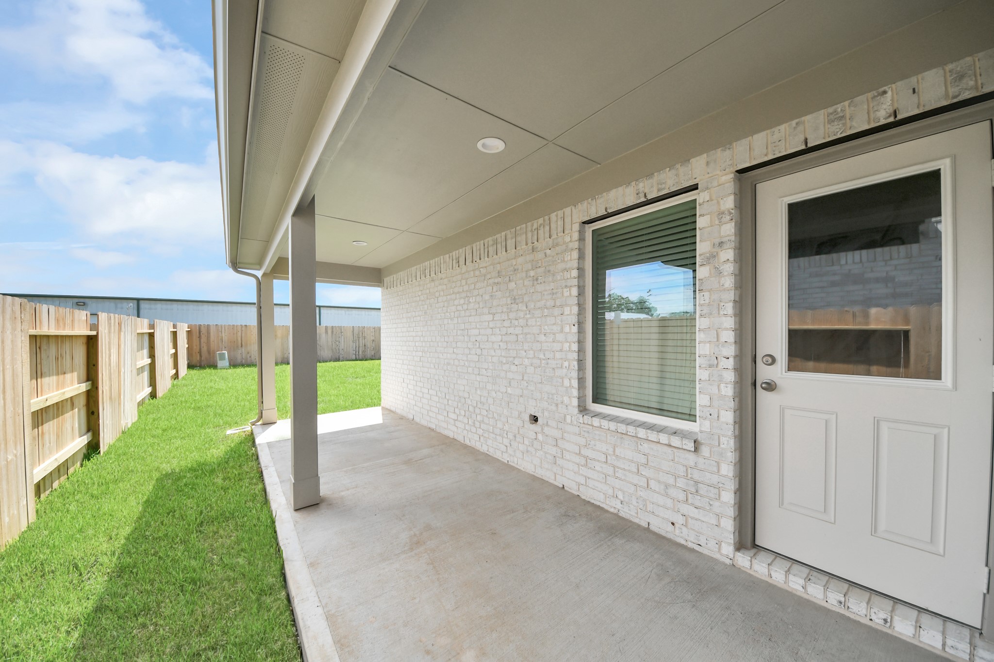Come and see this spacious backyard with its beautiful covered patio. There is plenty of room for the kids to play and adults to relax. Perfect for your outdoor living space, patio furniture, bbq pit, and so much more. The possibilities are endless! Sample photo of completed home with similar floor plan. Actual colors and selections may vary.
