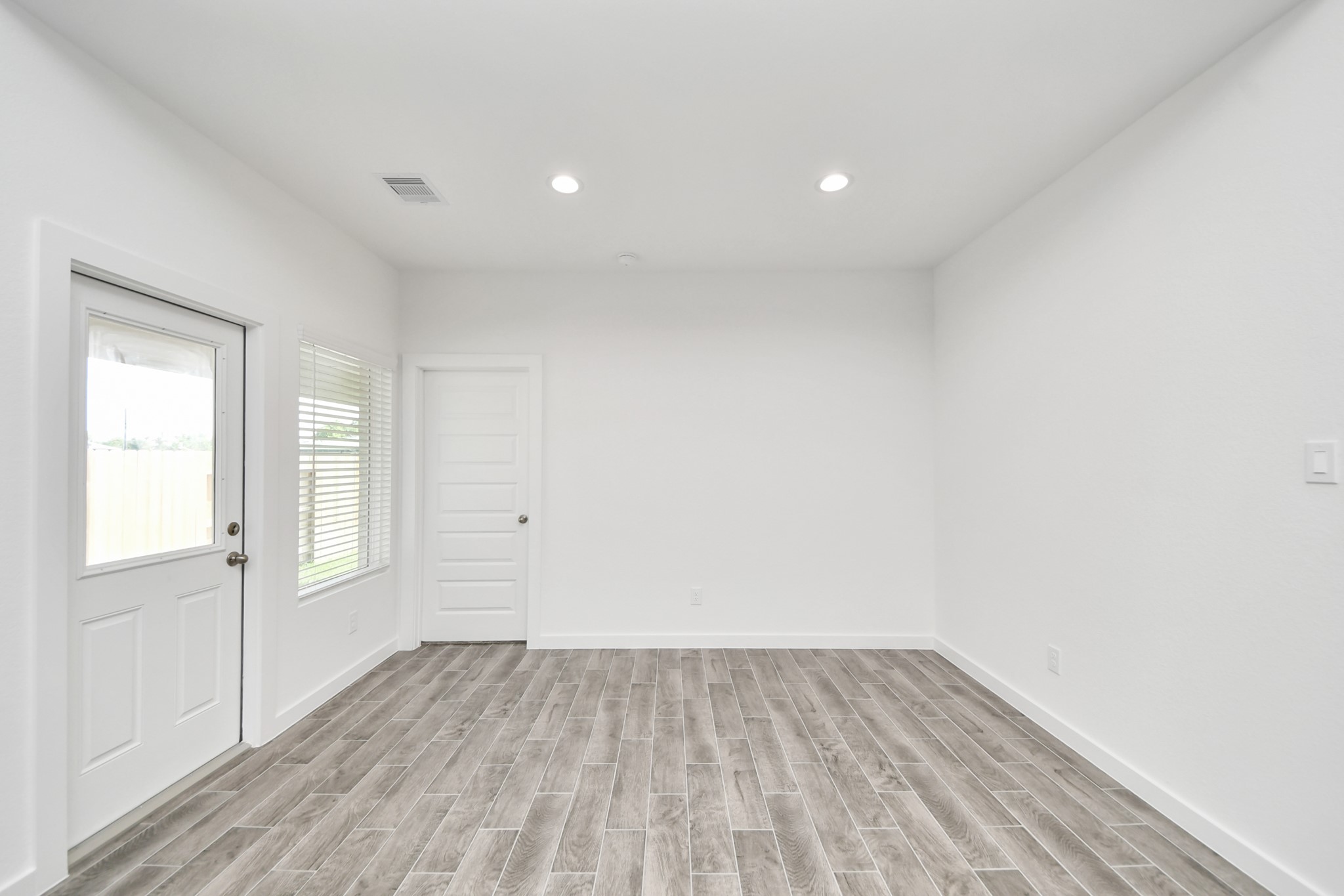Make memories gathered around the table with your family and friends! This spacious dining room features elegant flooring, custom paint, and adjacent to family room and kitchen for open concept feel. Sample photo of completed home with similar floor plan. Actual colors and selections may vary.