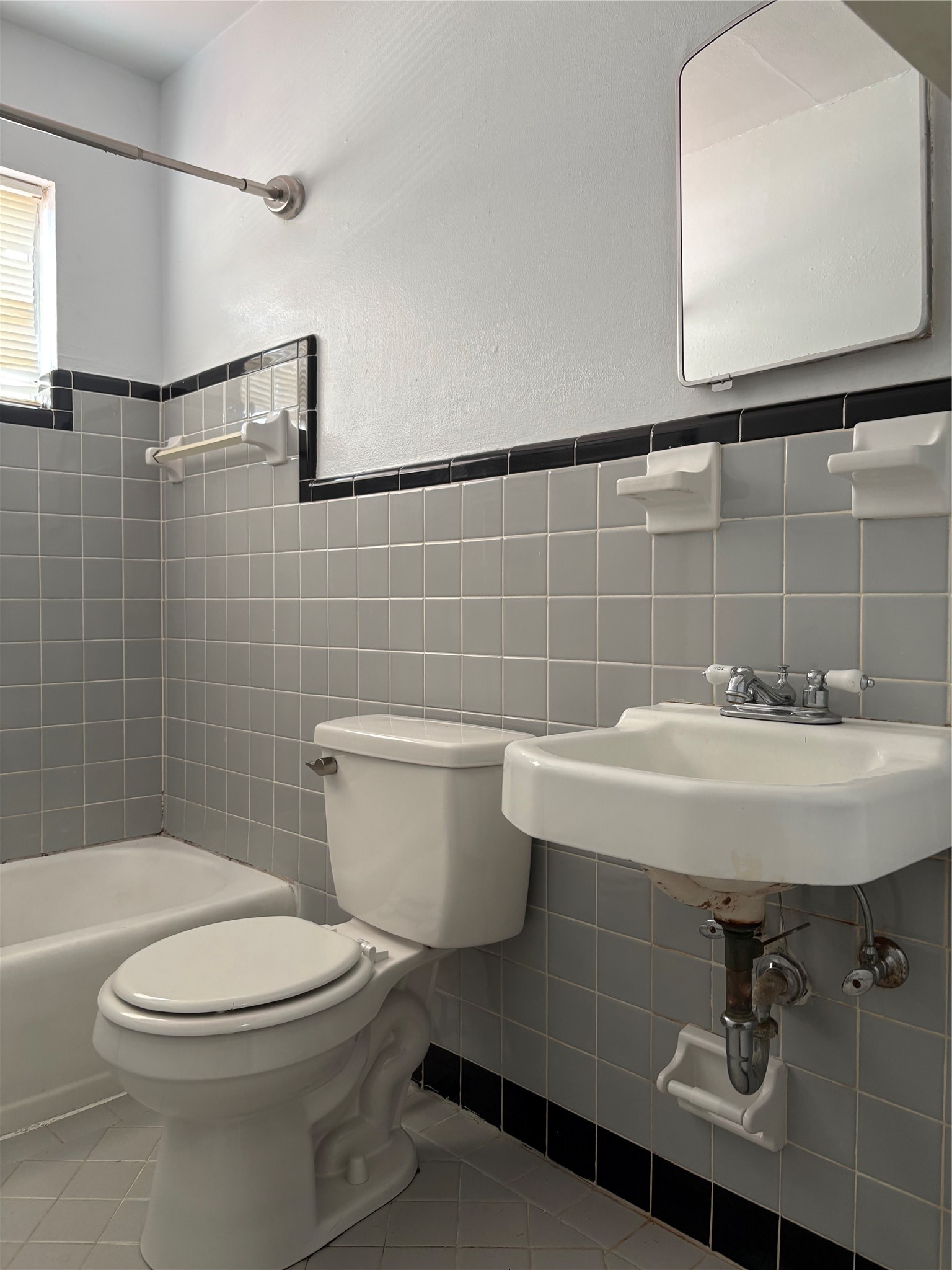 Neutral tone bathroom with tiled floor