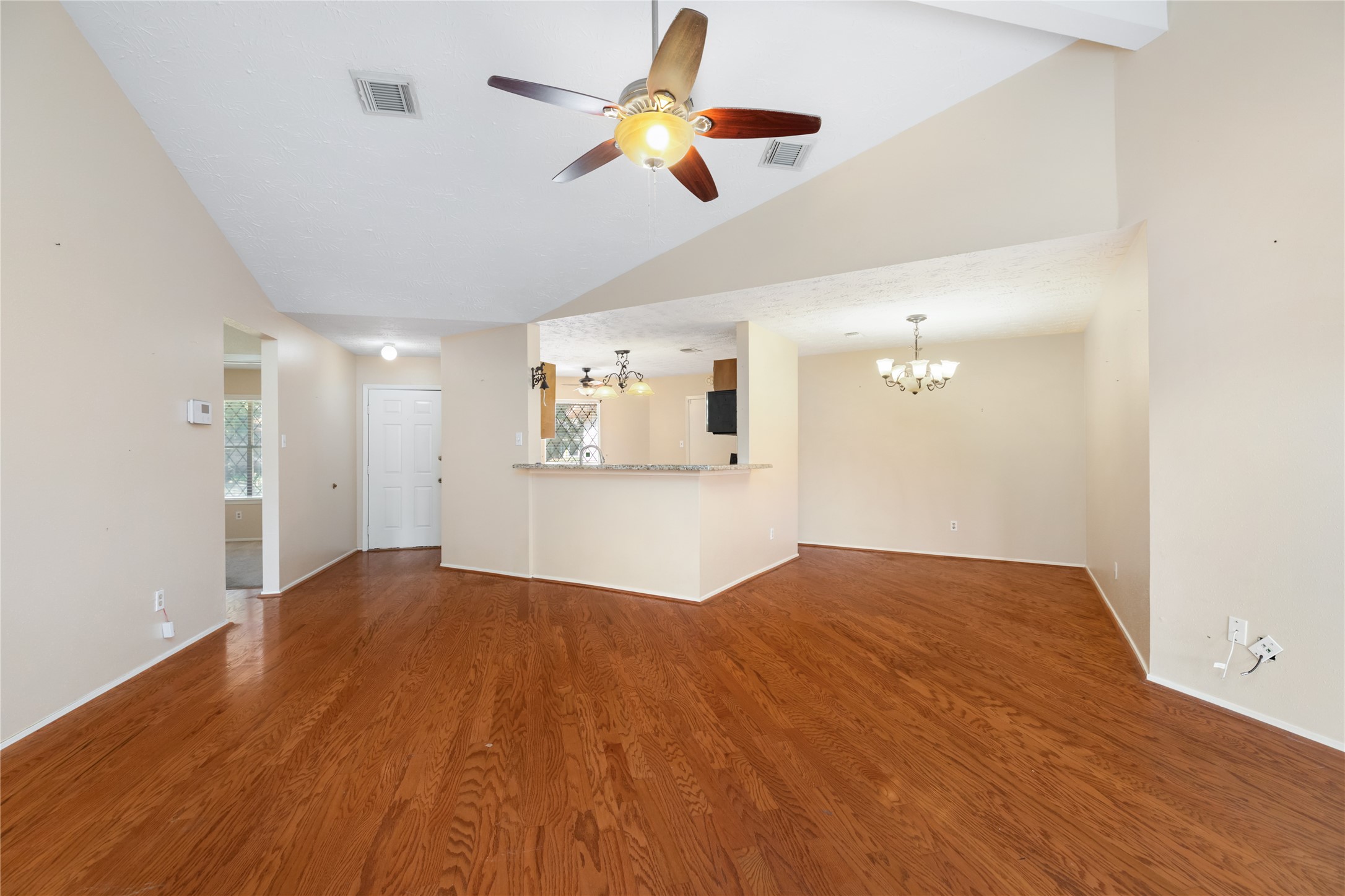Standing in living area, looking at dining room and kitchen Standing in living area, looking at dining room and kitchen