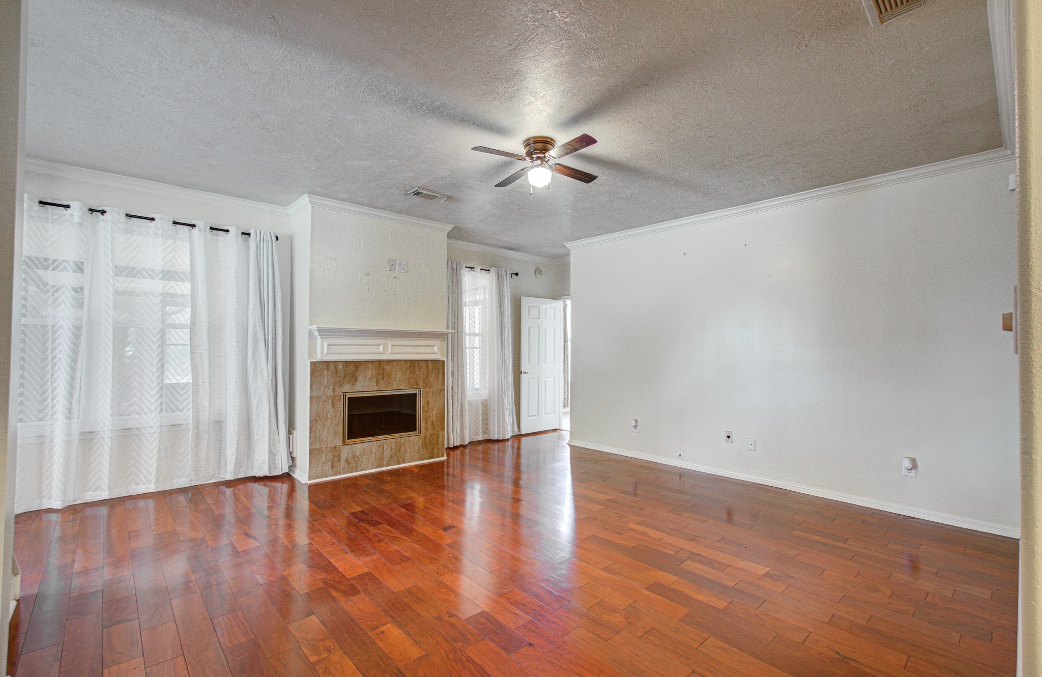 The family room boasts a wonderful fireplace to make the space very cozy