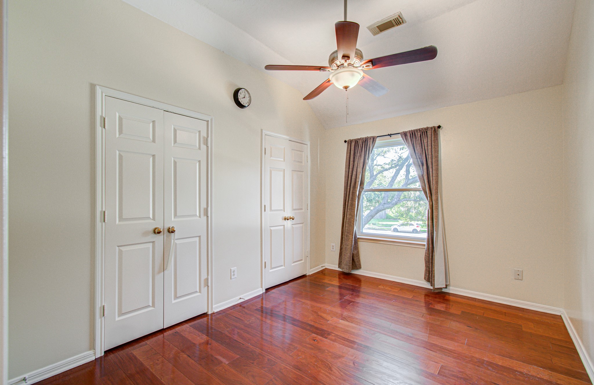 A secondary bedroom with double closets