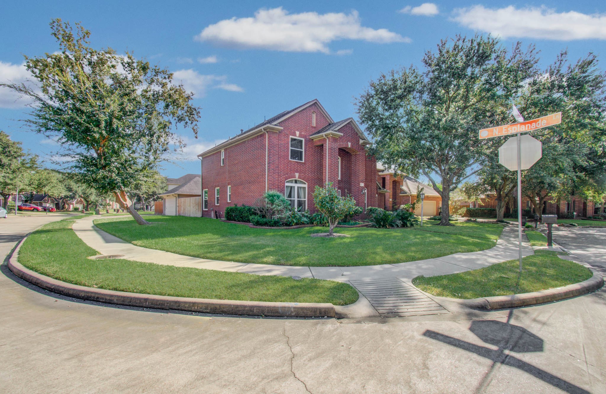 The house sits promininetly on this corner lot