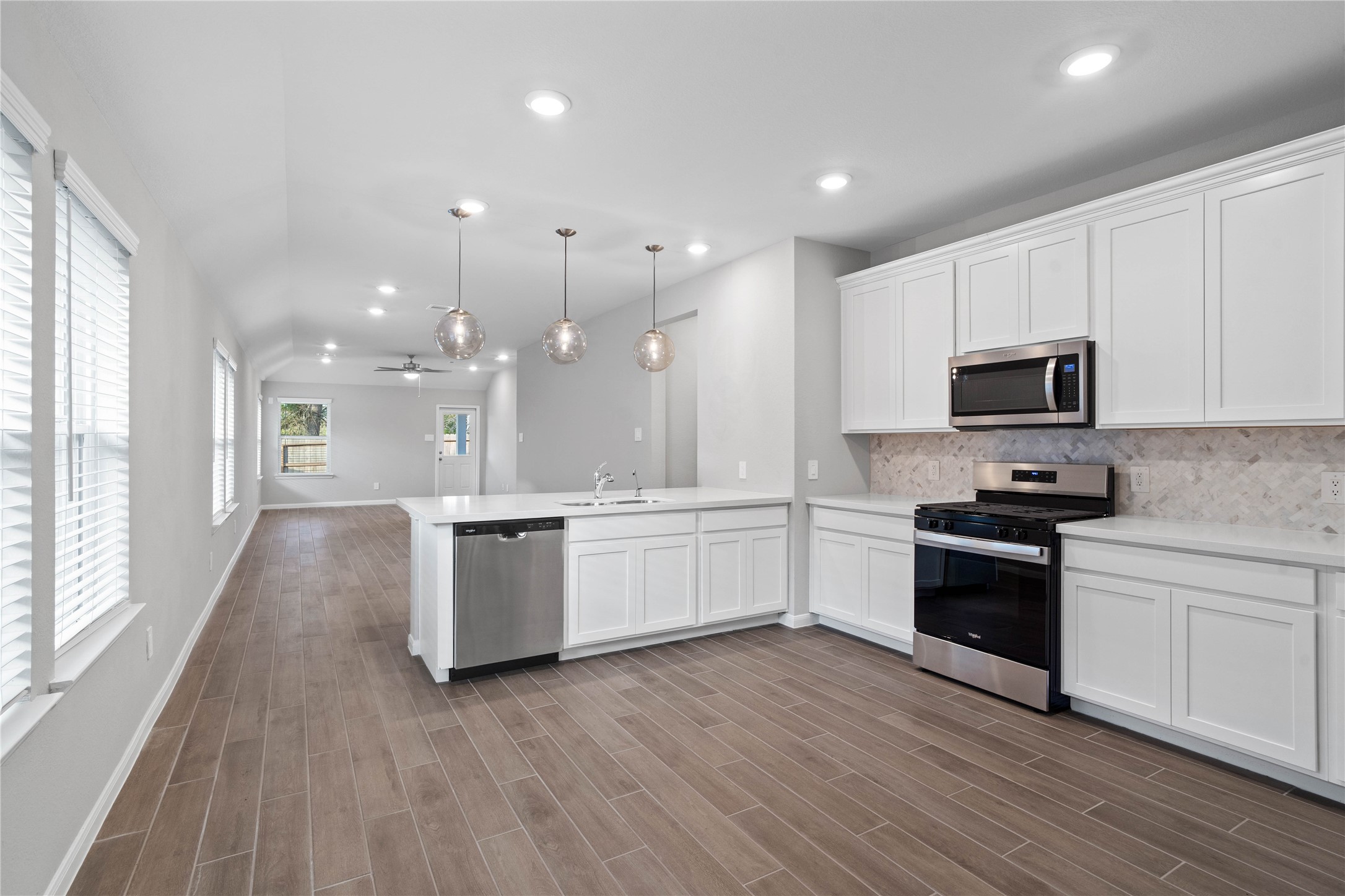 From the expansive kitchen, enjoy seamless sightlines across the open-concept living and dining areas, making entertaining a breeze and ensuring you're never far from the conversation.